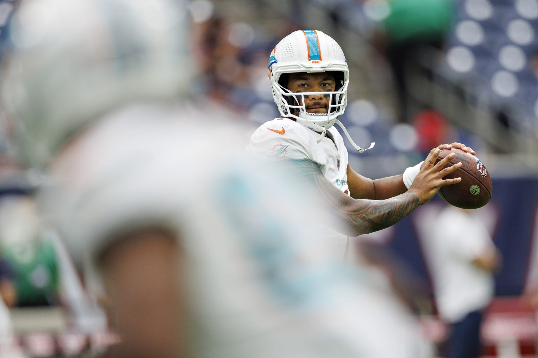 HOUSTON, TEXAS - AUGUST 19:  Tua Tagovailoa #1 of the Miami Dolphins warms up before the preseason game against the Houston Texans at NRG Stadium on August 19, 2023 in Houston, Texas. The Dolphins defeated the Texans 28-3.  (Photo by Wesley Hitt/Getty Images)