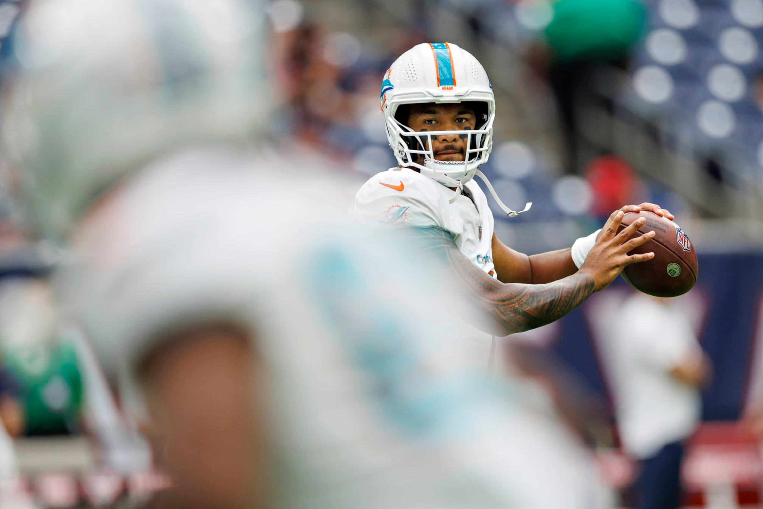 HOUSTON, TEXAS - AUGUST 19:  Tua Tagovailoa #1 of the Miami Dolphins warms up before the preseason game against the Houston Texans at NRG Stadium on August 19, 2023 in Houston, Texas. The Dolphins defeated the Texans 28-3.  (Photo by Wesley Hitt/Getty Images)