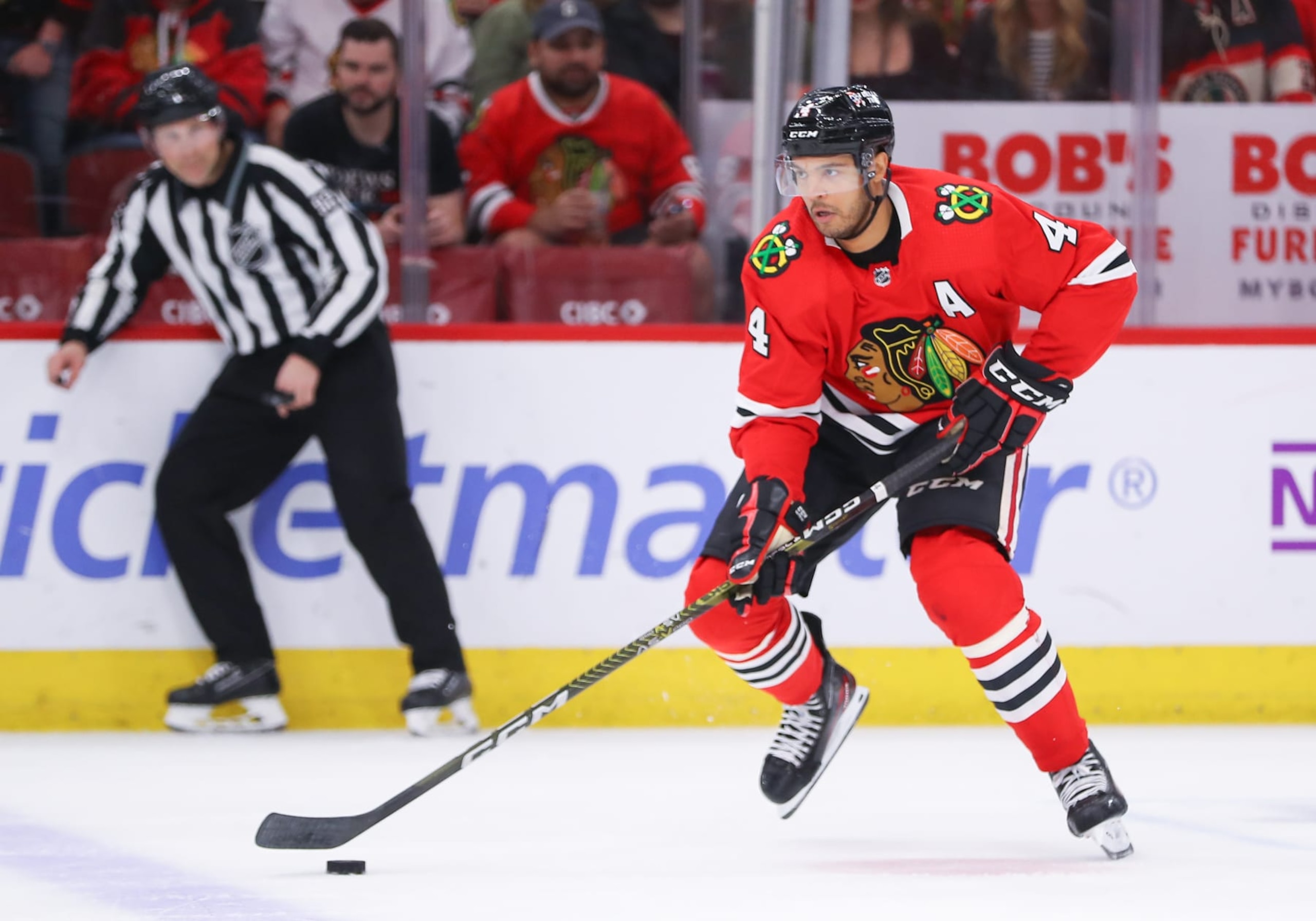 CHICAGO, IL - APRIL 13: Chicago Blackhawks defenseman Seth Jones (4) controls the puck during overtime during a game between the Philadelphia Flyers and the Chicago Blackhawks on April 13, 2023 at the United Center in Chicago, IL. (Photo by Melissa Tamez/Icon Sportswire via Getty Images)