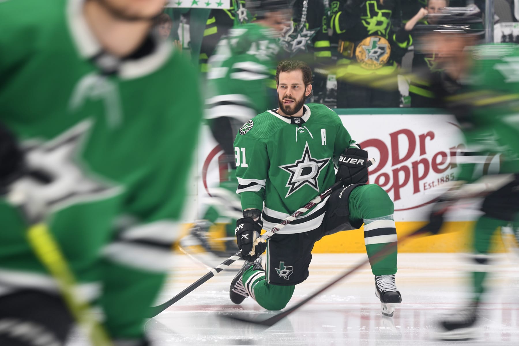 DALLAS, TEXAS - MAY 15: Tyler Seguin #91 of the Dallas Stars streches on the ice before Game Seven of the Second Round of the 2023 Stanley Cup Playoffs against the Seattle Kraken at American Airlines Center on May 15, 2023 in Dallas, Texas. (Photo by Sam Hodde/NHLI via Getty Images)