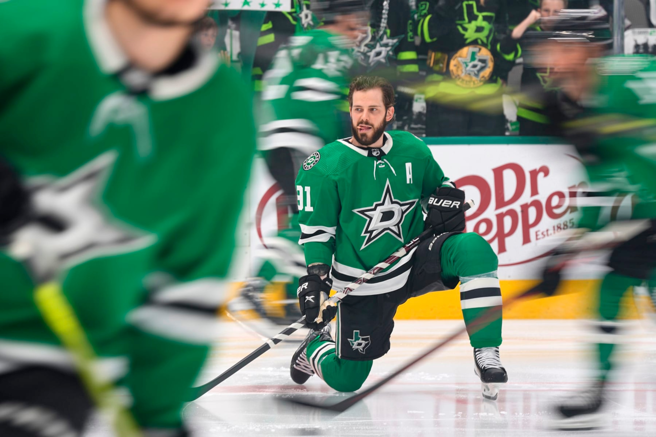 DALLAS, TEXAS - MAY 15: Tyler Seguin #91 of the Dallas Stars streches on the ice before Game Seven of the Second Round of the 2023 Stanley Cup Playoffs against the Seattle Kraken at American Airlines Center on May 15, 2023 in Dallas, Texas. (Photo by Sam Hodde/NHLI via Getty Images)