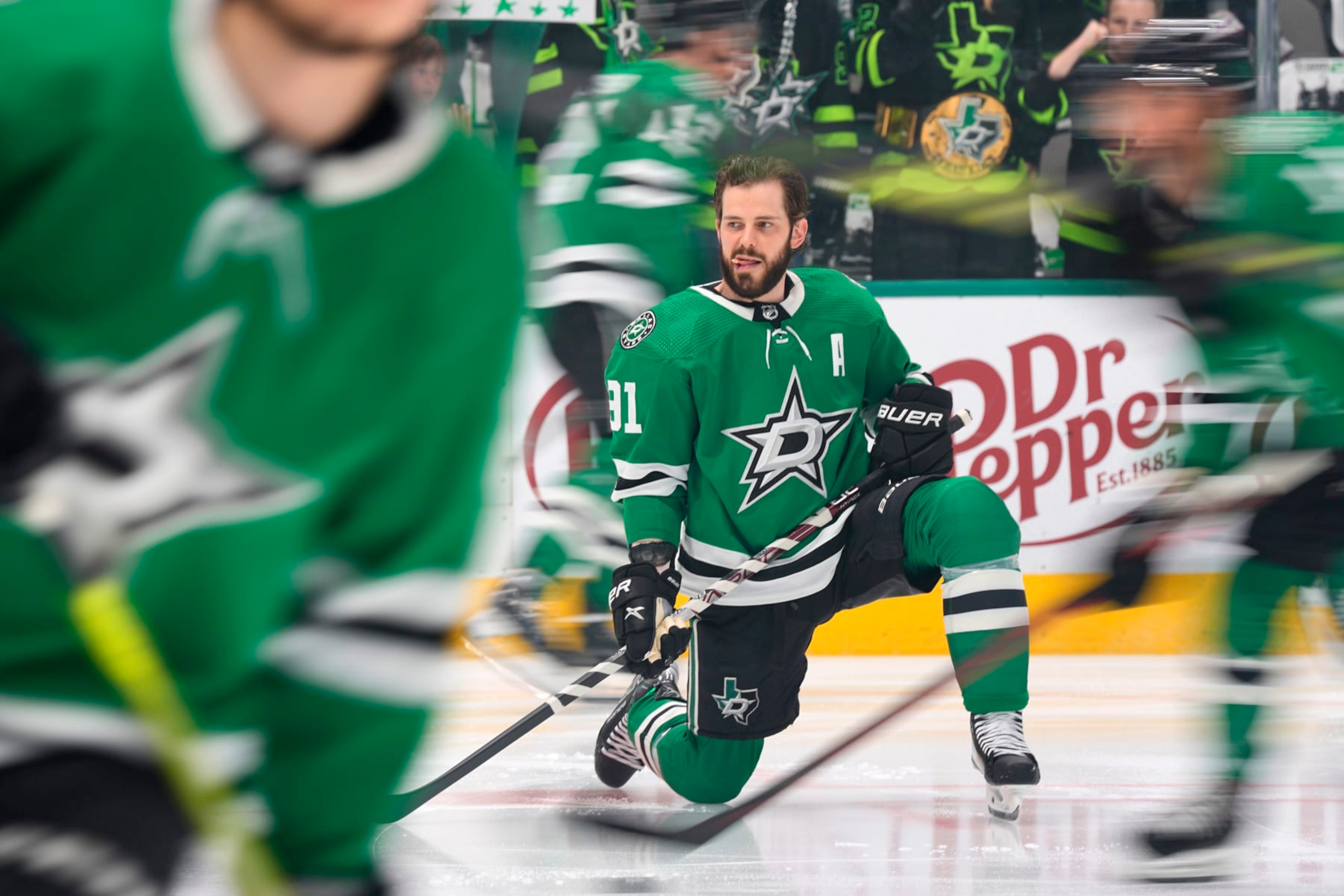 DALLAS, TEXAS - MAY 15: Tyler Seguin #91 of the Dallas Stars streches on the ice before Game Seven of the Second Round of the 2023 Stanley Cup Playoffs against the Seattle Kraken at American Airlines Center on May 15, 2023 in Dallas, Texas. (Photo by Sam Hodde/NHLI via Getty Images)