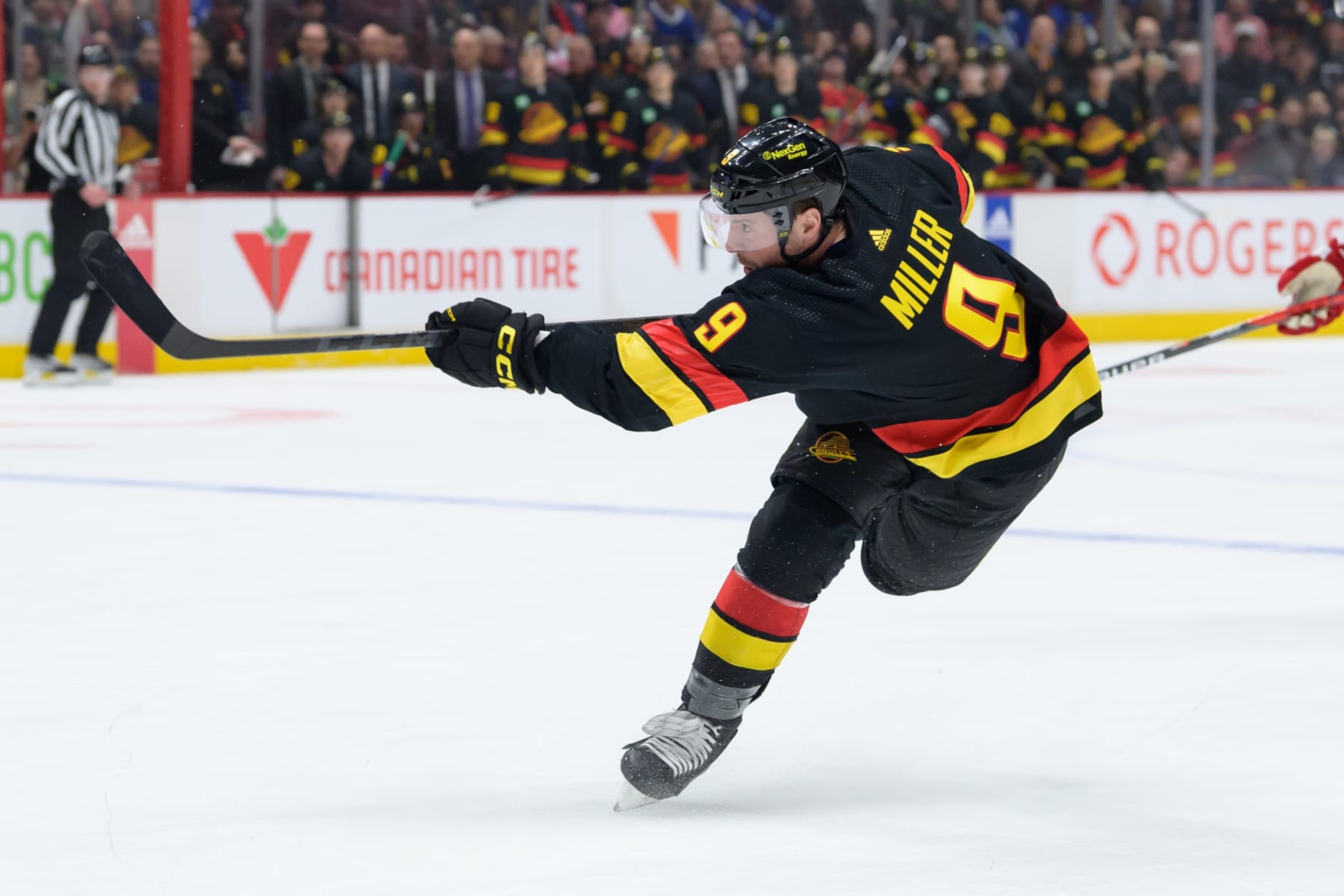 VANCOUVER, CANADA - APRIL 8: J.T. Miller #9 of the Vancouver Canucks takes a shot during the first period of their NHL game against the Calgary Flames at Rogers Arena on April 8, 2023 in Vancouver, British Columbia, Canada. (Photo by Derek Cain/Getty Images)