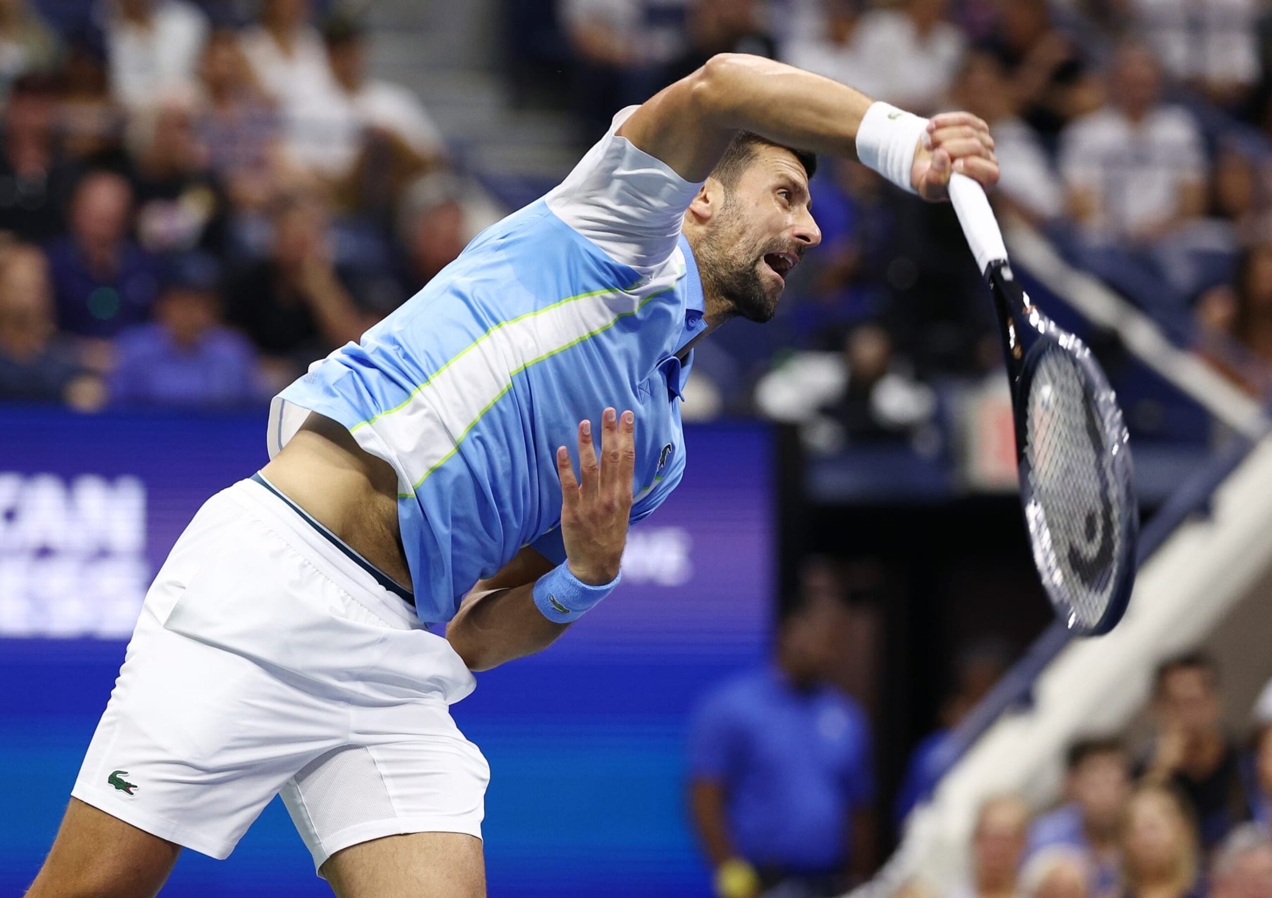 NEW YORK, NEW YORK - SEPTEMBER 08: Novak Djokovic of Serbia serves against Ben Shelton of the United States during their Men's Singles Semifinal match on Day Twelve of the 2023 US Open at the USTA Billie Jean King National Tennis Center on September 08, 2023 in the Flushing neighborhood of the Queens borough of New York City. (Photo by Elsa/Getty Images)