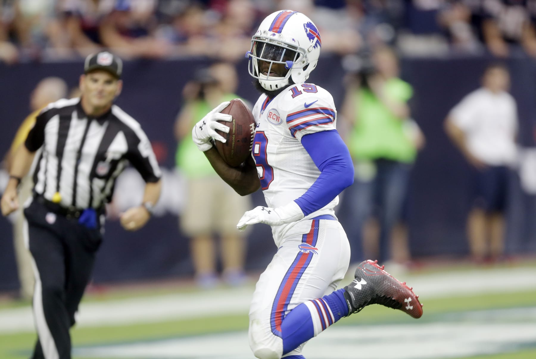 Buffalo Bills' Mike Williams (19) scores a touchdown against the Houston Texans during the fourth quarter of an NFL football game, Sunday, Sept. 28, 2014, in Houston. (AP Photo/Patric Schneider)