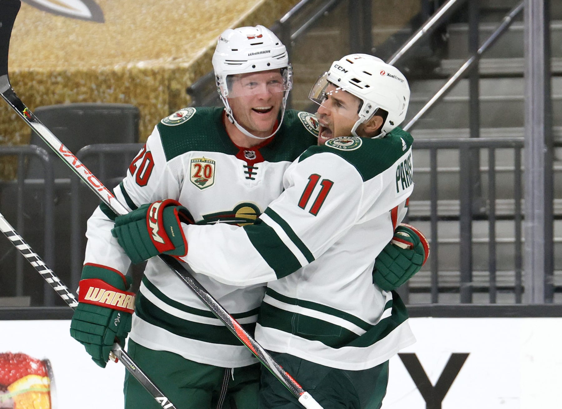 LAS VEGAS, NEVADA - MAY 28:  Ryan Suter #20 and Zach Parise #11 of the Minnesota Wild celebrate after Suter assisted Parise on a first-period goal against the Vegas Golden Knights in Game Seven of the First Round of the 2021 Stanley Cup Playoffs at T-Mobile Arena on May 28, 2021 in Las Vegas, Nevada.  (Photo by Ethan Miller/Getty Images)