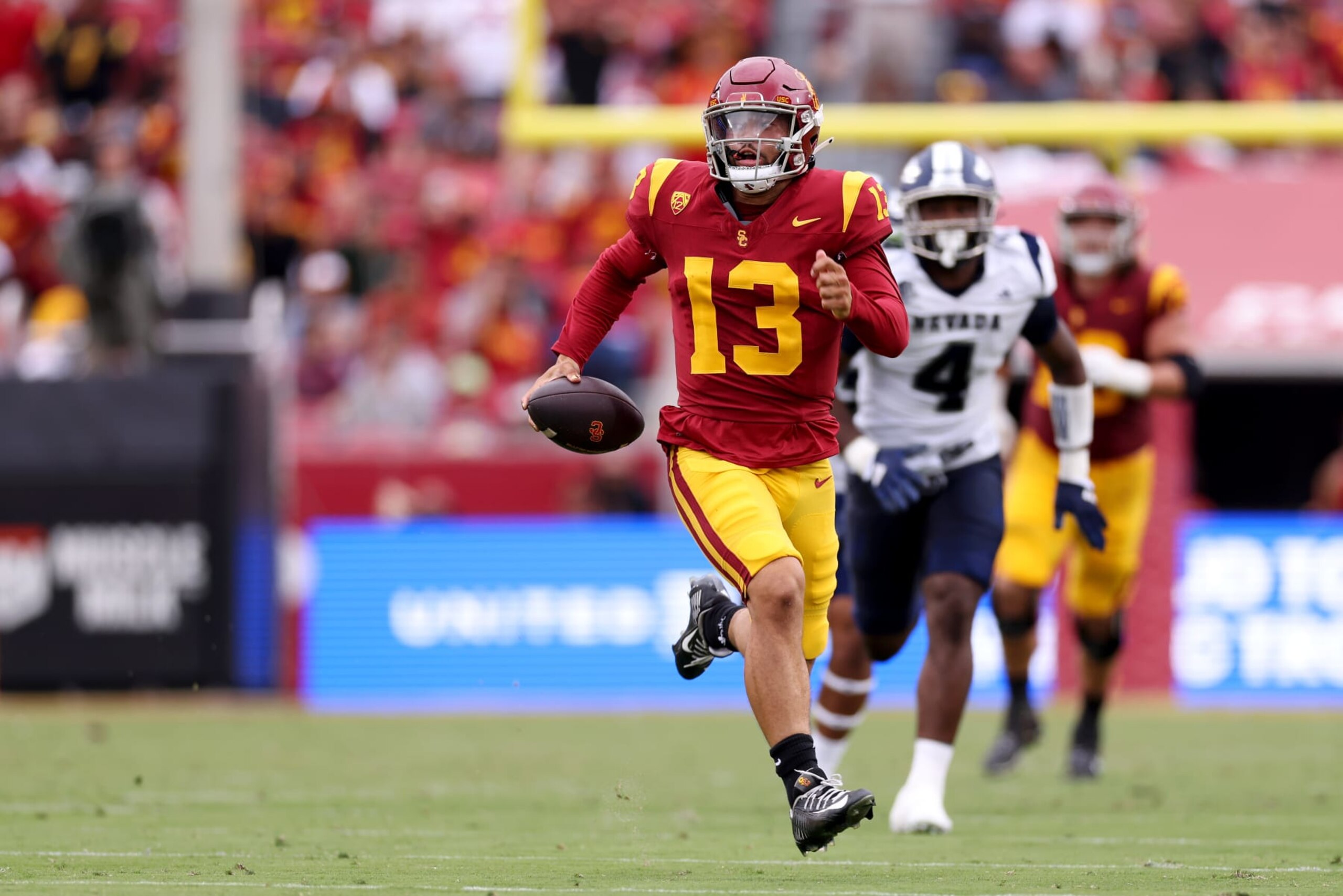 LOS ANGELES, CALIFORNIA - SEPTEMBER 02: Caleb Williams #13 of the USC Trojans runs the ball during the second quarter against the Nevada Wolf Pack at United Airlines Field at the Los Angeles Memorial Coliseum on September 02, 2023 in Los Angeles, California. (Photo by Katelyn Mulcahy/Getty Images)