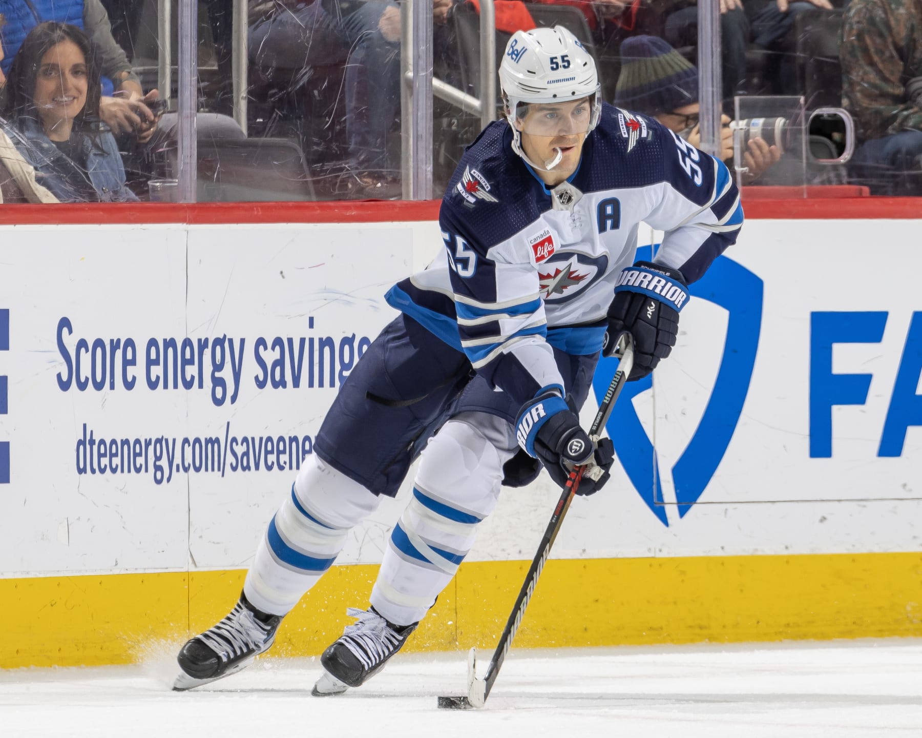 DETROIT, MI - JANUARY 10: Mark Scheifele #55 of the Winnipeg Jets controls the puck against the Detroit Red Wings during the first period of an NHL game at Little Caesars Arena on January 10, 2023 in Detroit, Michigan. Detroit defeated Winnipeg 7-5. (Photo by Dave Reginek/NHLI via Getty Images)