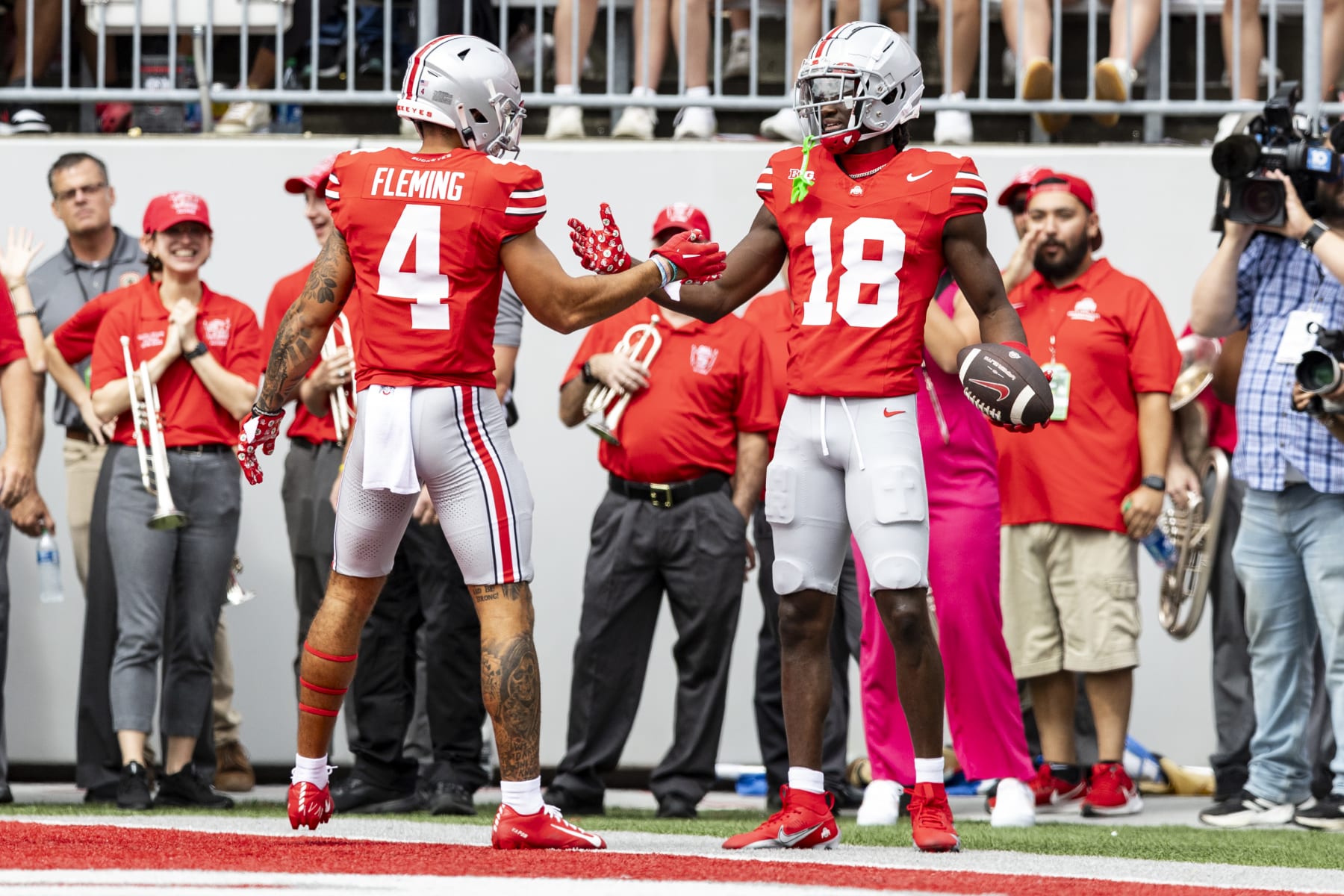 COLUMBUS, OHIO - SEPTEMBER 9: Marvin Harrison Jr. #18 of the Ohio State Buckeyes high fives Julian Fleming #4 after scoring a touchdown during the first quarter of the game against the Youngstown State Penguins at Ohio Stadium on September 9, 2023 in Columbus, Ohio. (Photo by Lauren Leigh Bacho/Getty Images)