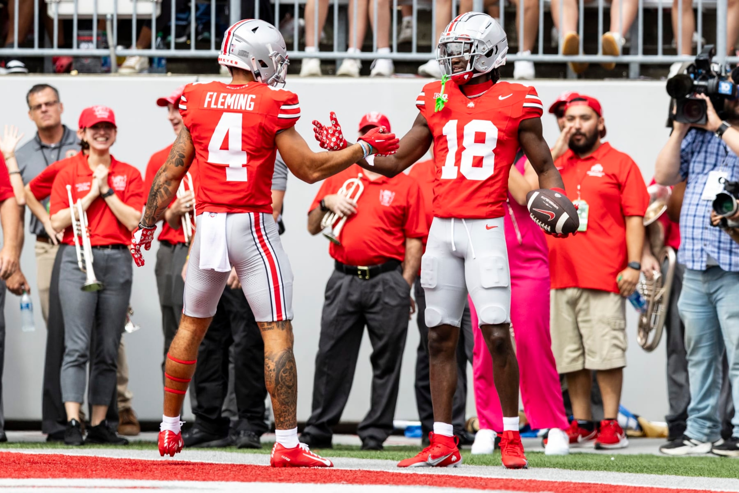 COLUMBUS, OHIO - SEPTEMBER 9: Marvin Harrison Jr. #18 of the Ohio State Buckeyes high fives Julian Fleming #4 after scoring a touchdown during the first quarter of the game against the Youngstown State Penguins at Ohio Stadium on September 9, 2023 in Columbus, Ohio. (Photo by Lauren Leigh Bacho/Getty Images)