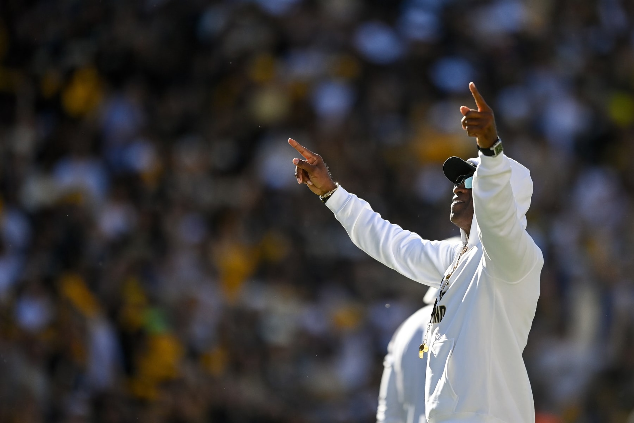 BOULDER, CO - SEPTEMBER 9:  Head coach Deion Sanders of the Colorado Buffaloes points to the crowd before a game against the Nebraska Cornhuskers at Folsom Field on September 9, 2023 in Boulder, Colorado. (Photo by Dustin Bradford/Getty Images)