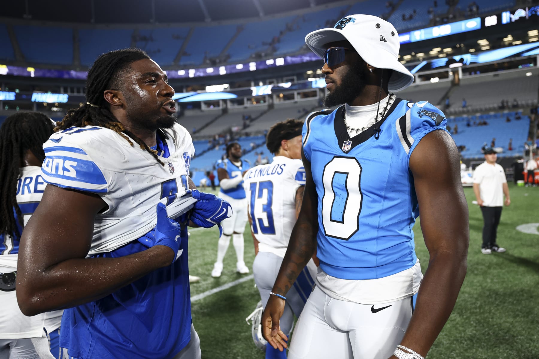 CHARLOTTE, NC - AUGUST 25: James Houston #41 of the Detroit Lions talks with Brian Burns #0 of the Carolina Panthers after an NFL preseason football game at Bank of America Stadium on August 25, 2023 in Charlotte, North Carolina. (Photo by Kevin Sabitus/Getty Images)