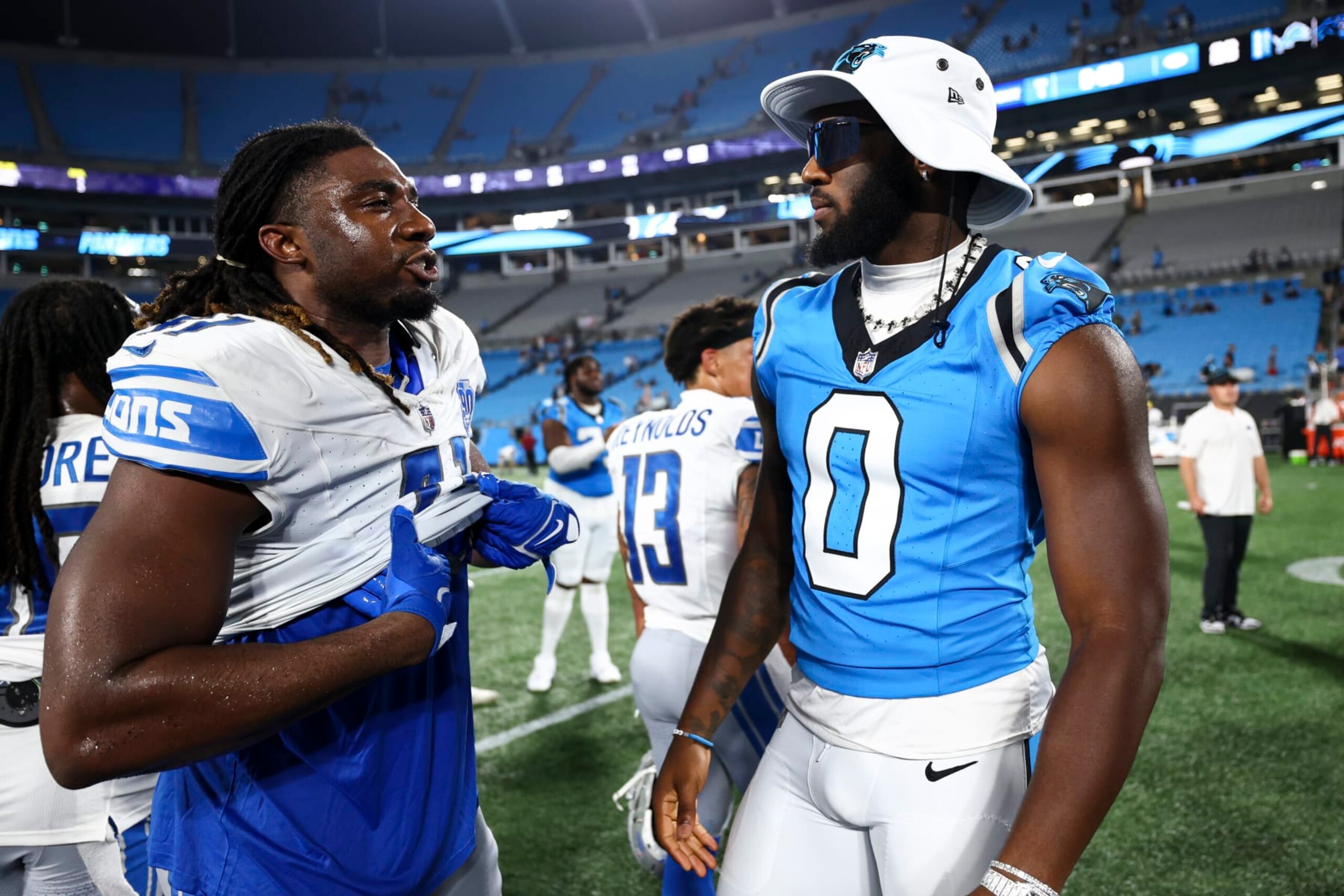 CHARLOTTE, NC - AUGUST 25: James Houston #41 of the Detroit Lions talks with Brian Burns #0 of the Carolina Panthers after an NFL preseason football game at Bank of America Stadium on August 25, 2023 in Charlotte, North Carolina. (Photo by Kevin Sabitus/Getty Images)