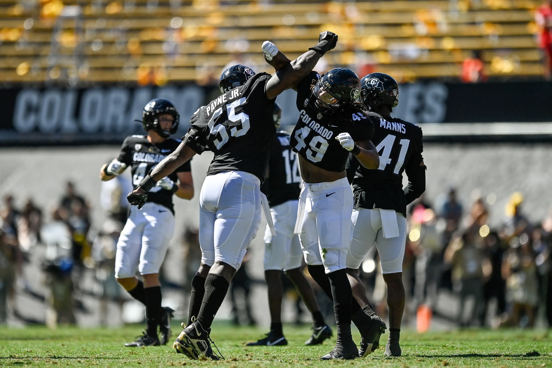 BOULDER, CO - SEPTEMBER 9:  Defensive lineman Leonard Payne Jr. #55 of the Colorado Buffaloes celebrates with defensive end Taijh Alston #49 after a second quarter sack against the Nebraska Cornhuskers at Folsom Field on September 9, 2023 in Boulder, Colorado. (Photo by Dustin Bradford/Getty Images)