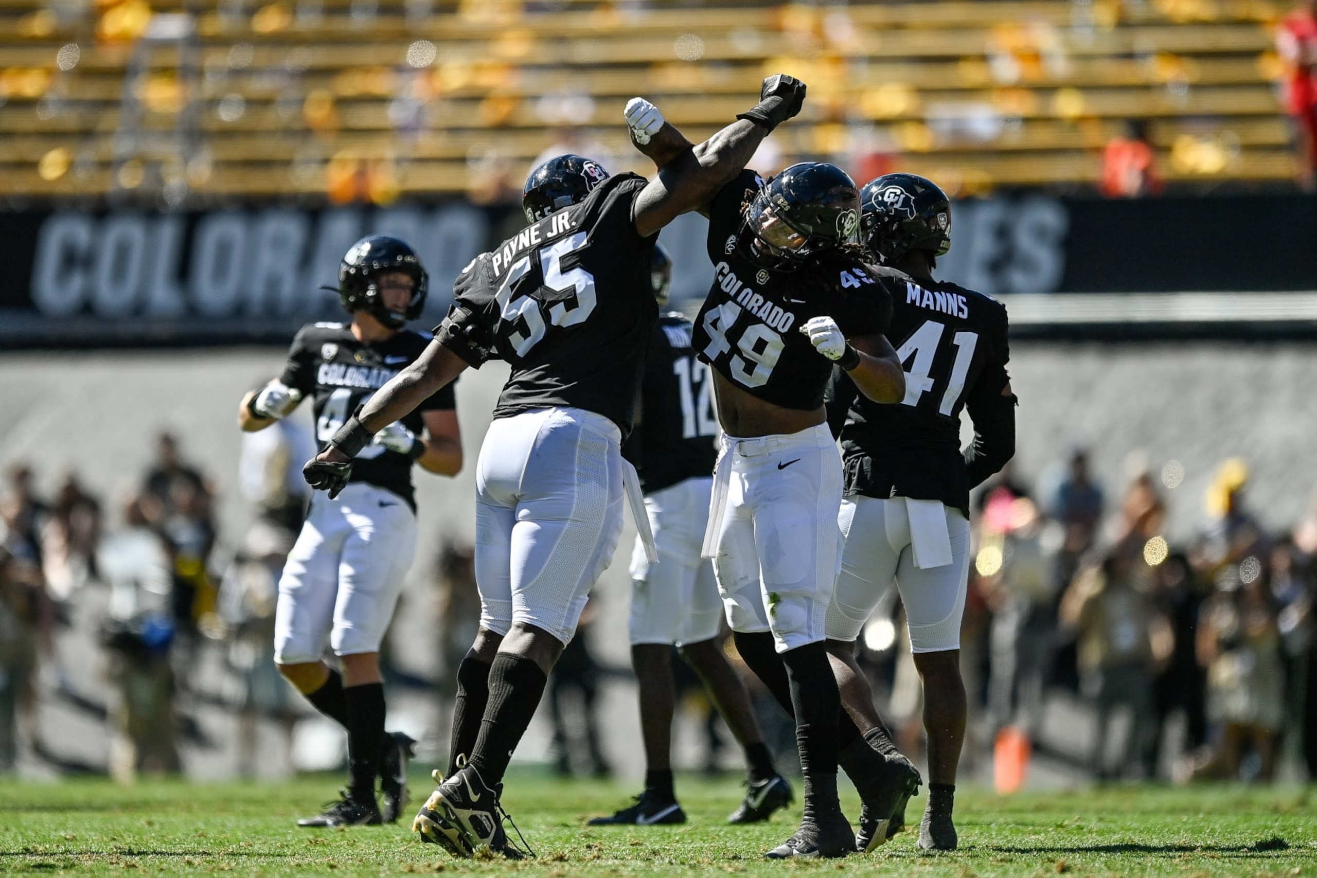 BOULDER, CO - SEPTEMBER 9:  Defensive lineman Leonard Payne Jr. #55 of the Colorado Buffaloes celebrates with defensive end Taijh Alston #49 after a second quarter sack against the Nebraska Cornhuskers at Folsom Field on September 9, 2023 in Boulder, Colorado. (Photo by Dustin Bradford/Getty Images)