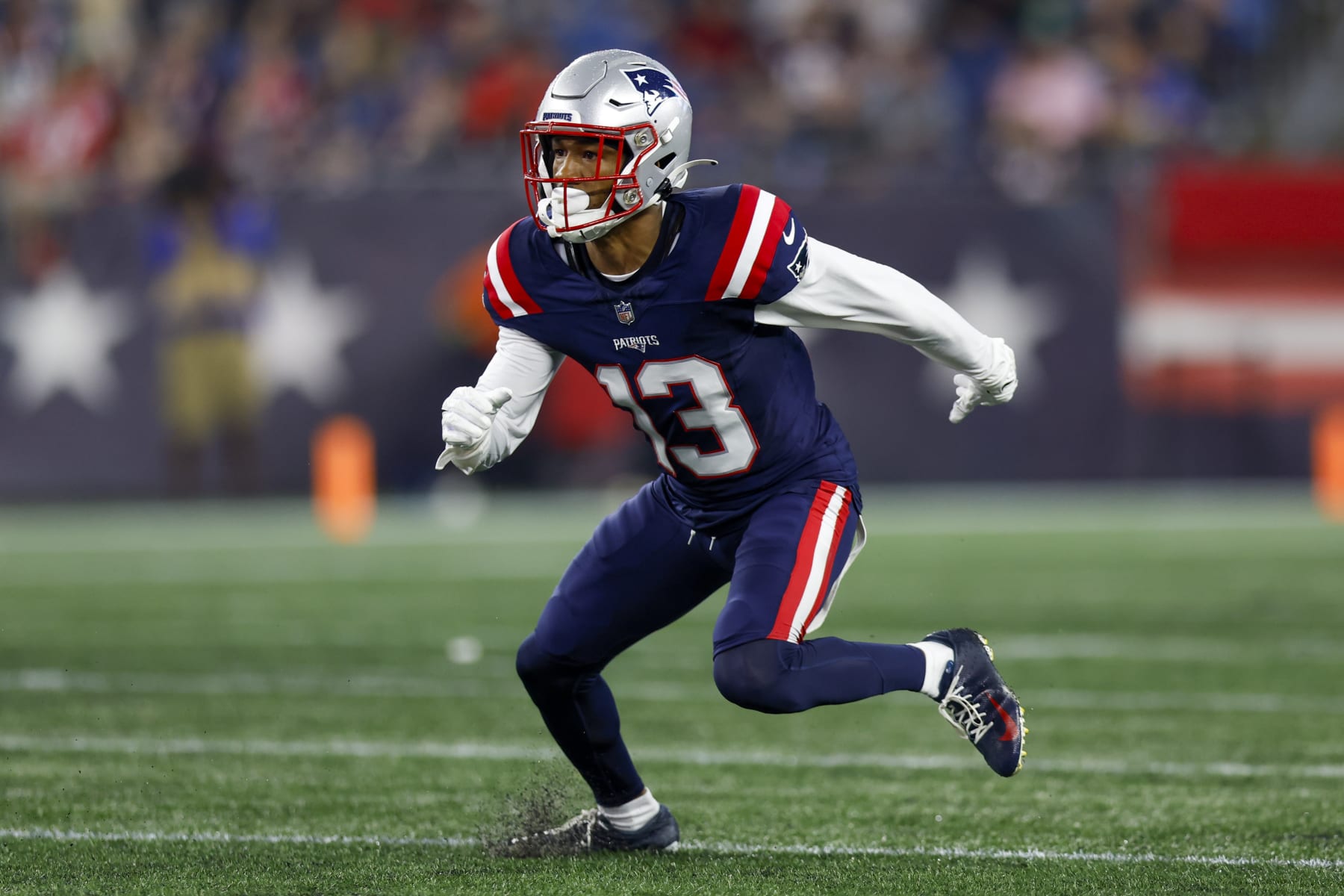 New England Patriots defensive back Jack Jones (13) prepares to defend during the first half of an NFL pre-season football game against the Houston Texans, Thursday, Aug. 10, 2023, in Foxborough, Mass. (AP Photo/Greg M. Cooper)