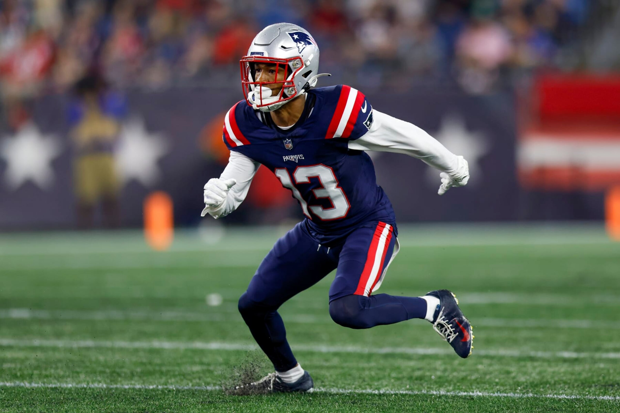 New England Patriots defensive back Jack Jones (13) prepares to defend during the first half of an NFL pre-season football game against the Houston Texans, Thursday, Aug. 10, 2023, in Foxborough, Mass. (AP Photo/Greg M. Cooper)