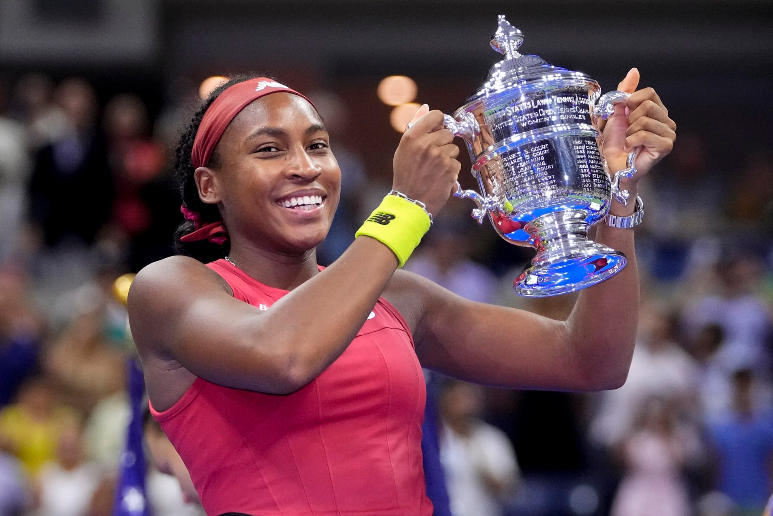Coco Gauff, of the United States, holds up the championship trophy after defeating Aryna Sabalenka, of Belarus, in the women's singles final of the U.S. Open tennis championships, Saturday, Sept. 9, 2023, in New York. (AP Photo/Frank Franklin II)