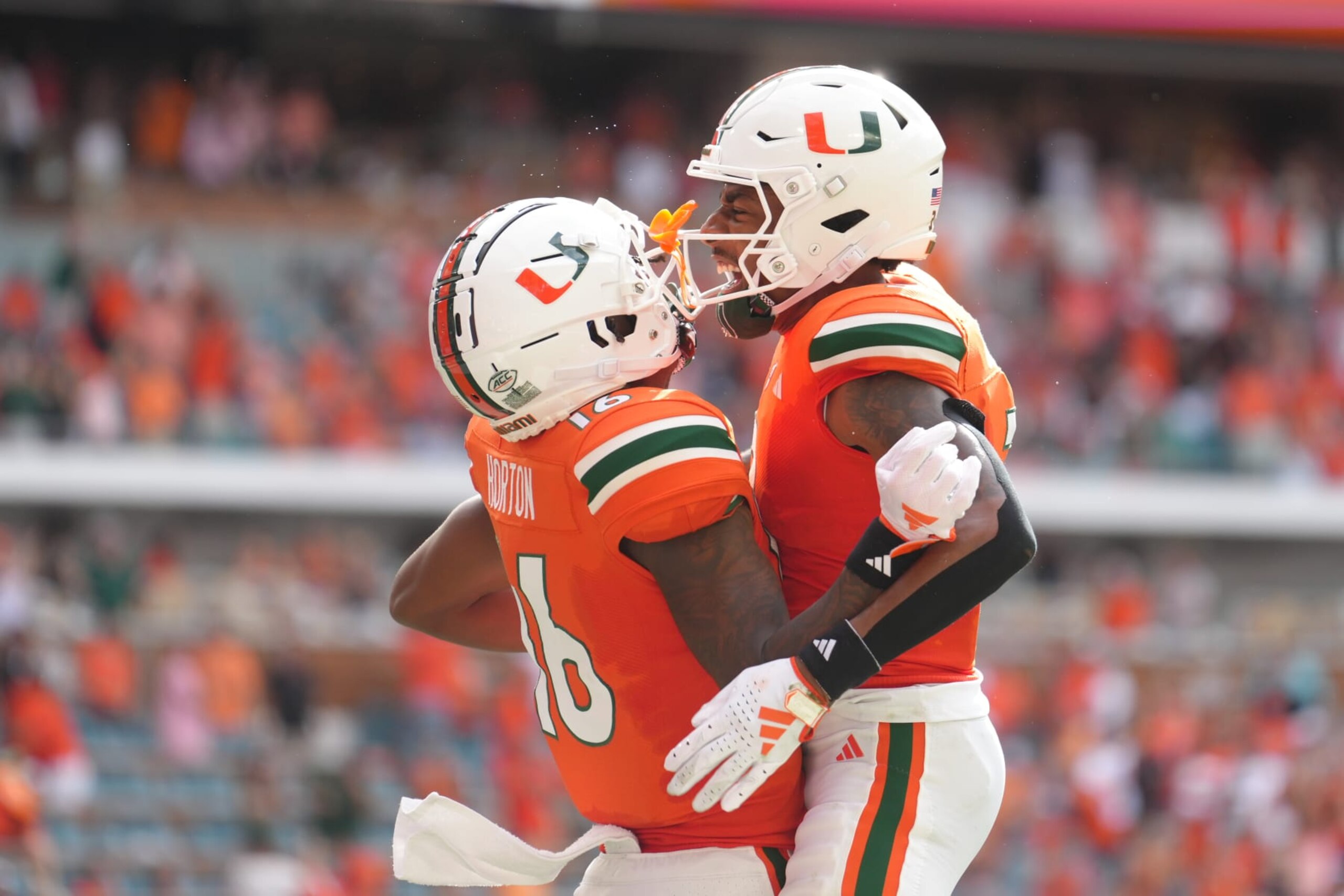 MIAMI GARDENS, FL - SEPTEMBER 09: Miami Hurricanes wide receiver Isaiah Horton (16) celebrates his touchdown catch with Miami Hurricanes wide receiver Jacolby George (3) in the first half during the game between the Texas A&M Aggies and the Miami Hurricanes on Saturday, Sept 9, 2023 at Hard Rock Stadium, Miami Gardens, Fla. (Photo by Peter Joneleit/Icon Sportswire via Getty Images)