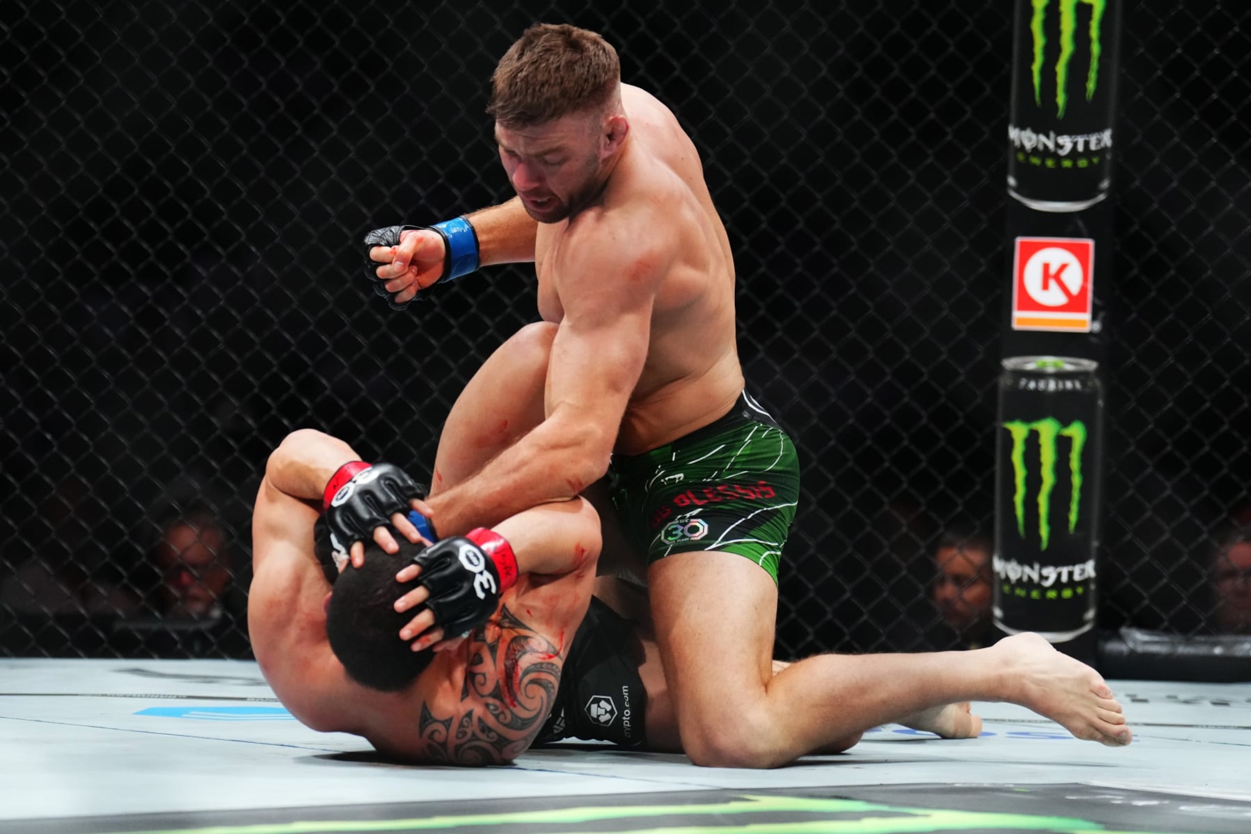 LAS VEGAS, NEVADA - JULY 08: (R-L) Dricus Du Plessis of South Africa punches Robert Whittaker of New Zealand in a middleweight fight during the UFC 290 event at T-Mobile Arena on July 08, 2023 in Las Vegas, Nevada. (Photo by Chris Unger/Zuffa LLC via Getty Images)