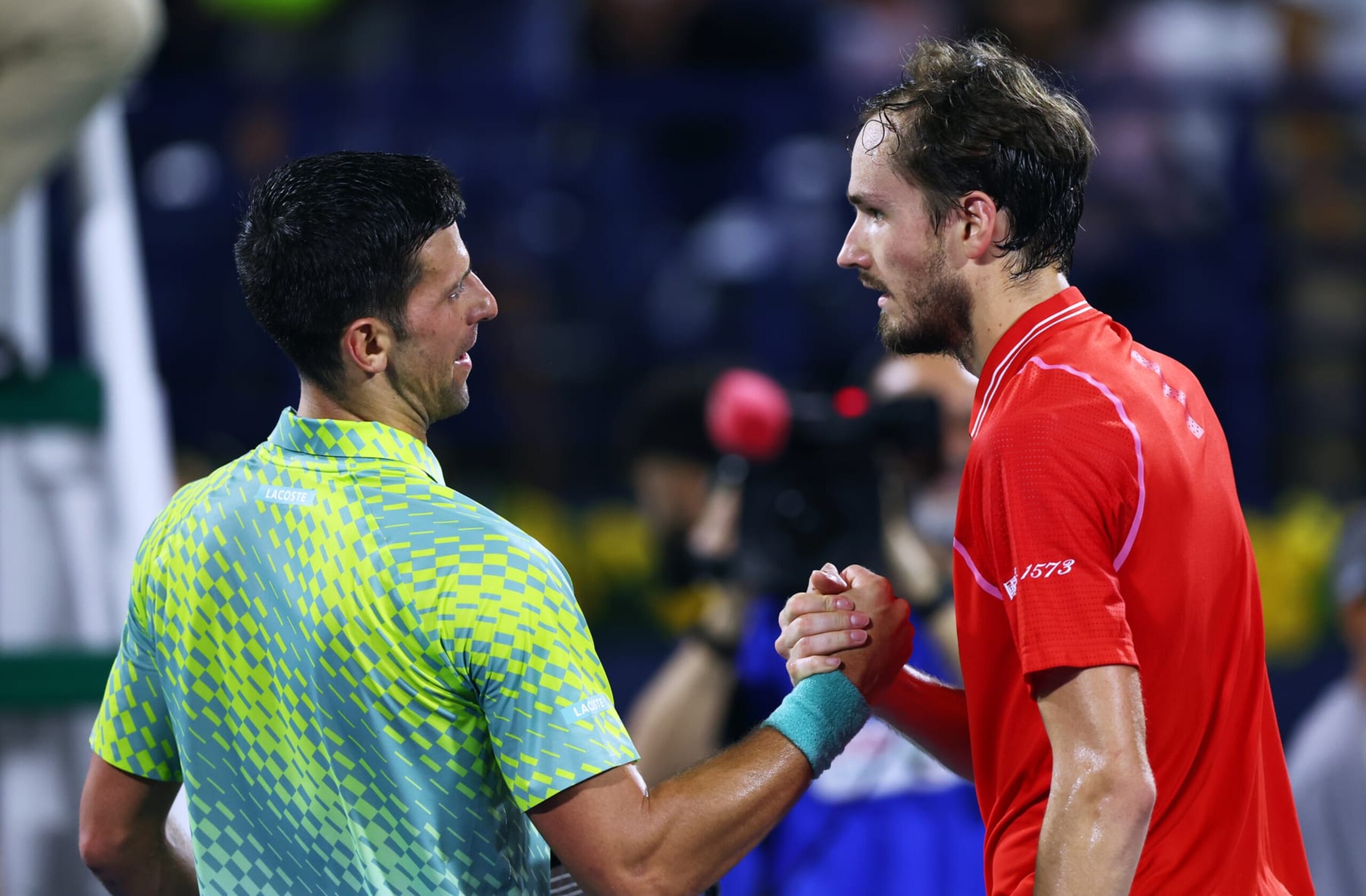 DUBAI, UNITED ARAB EMIRATES - MARCH 03: Novak Djokovic of Serbia shakes hands with Daniil Medvedev after being defeated by him during day thirteen of the Dubai Duty Free Tennis at Dubai Duty Free Tennis Stadium on March 03, 2023 in Dubai, United Arab Emirates. (Photo by Amin Mohammad Jamali/Getty Images)