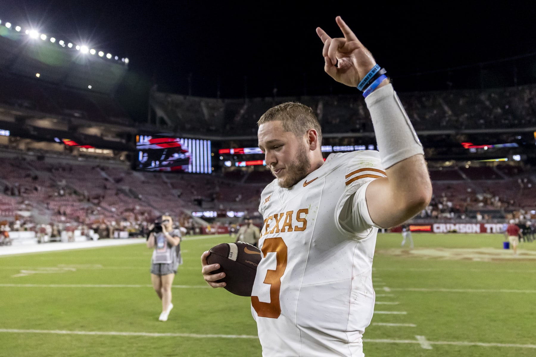 Texas quarterback Quinn Ewers (3) celebrates after a win over Alabama in an NCAA college football game, Saturday, Sept. 9, 2023, in Tuscaloosa, Ala. (AP Photo/Vasha Hunt)