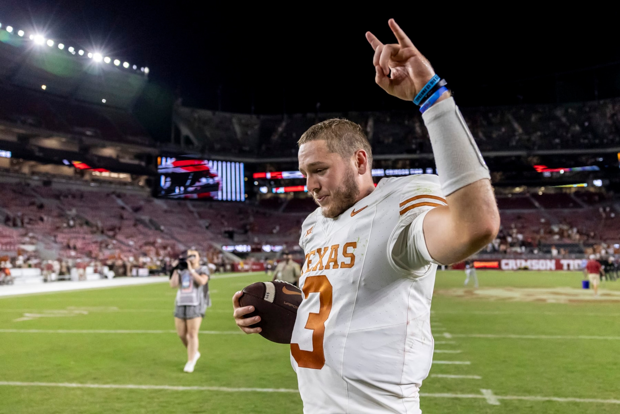 Texas quarterback Quinn Ewers (3) celebrates after a win over Alabama in an NCAA college football game, Saturday, Sept. 9, 2023, in Tuscaloosa, Ala. (AP Photo/Vasha Hunt) Texas quarterback Quinn Ewers (3) celebrates after a win over Alabama in an NCAA college football game, Saturday, Sept. 9, 2023, in Tuscaloosa, Ala. (AP Photo/Vasha Hunt)