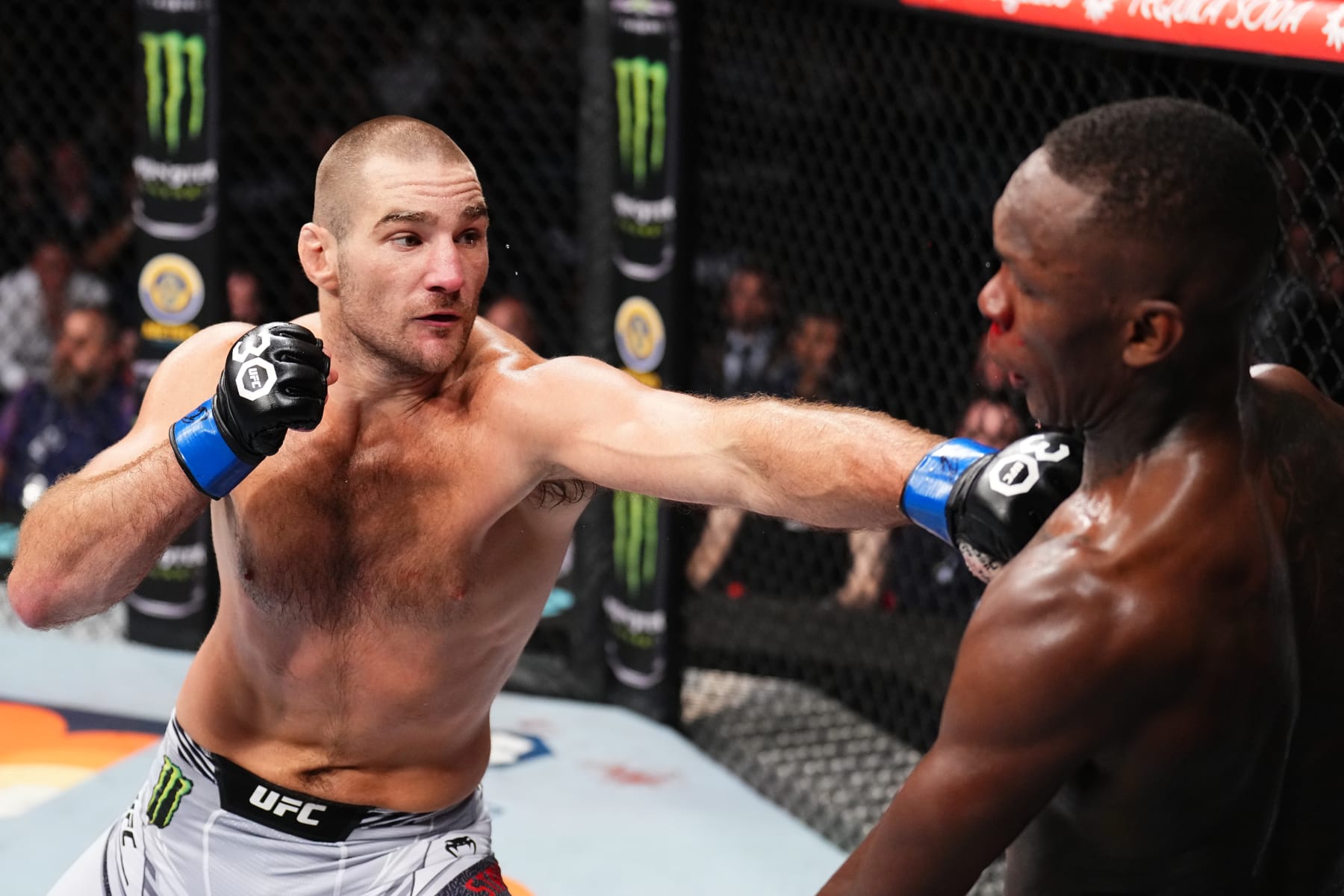 SYDNEY, AUSTRALIA - SEPTEMBER 10: (L-R) Sean Strickland punches Israel Adesanya of Nigeria in the UFC middleweight championship fight during the UFC 293 event at Qudos Bank Arena on September 10, 2023 in Sydney, Australia. (Photo by Chris Unger/Zuffa LLC via Getty Images)