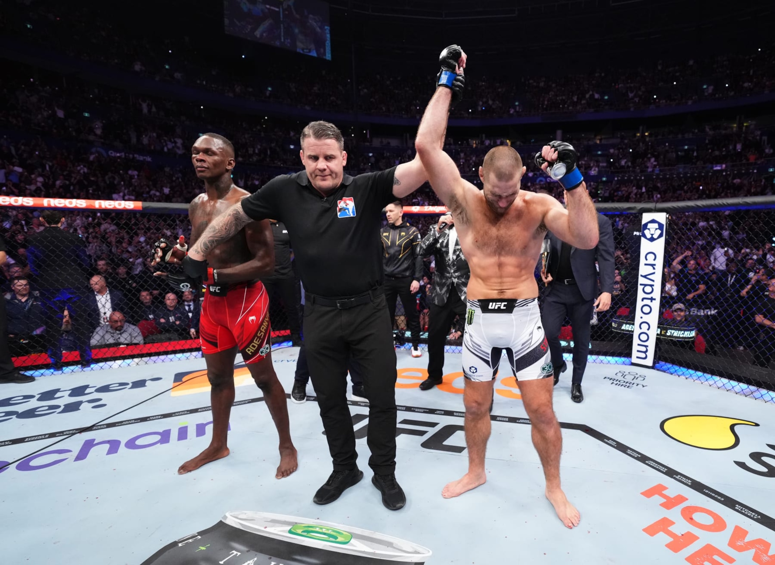 Sean Strickland (right) defeats Israel Adesanya by unanimous decision at UFC 293.