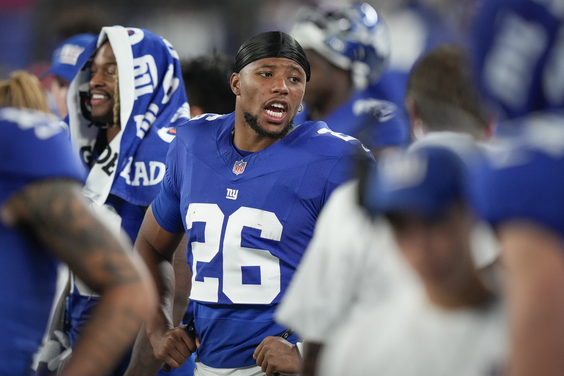 New York Giants running back Saquon Barkley stands on the sidelines during the second half of an NFL preseason football game against the Carolina Panthers, Friday, Aug. 18, 2023, in East Rutherford, N.J. (AP Photo/Bryan Woolston)
