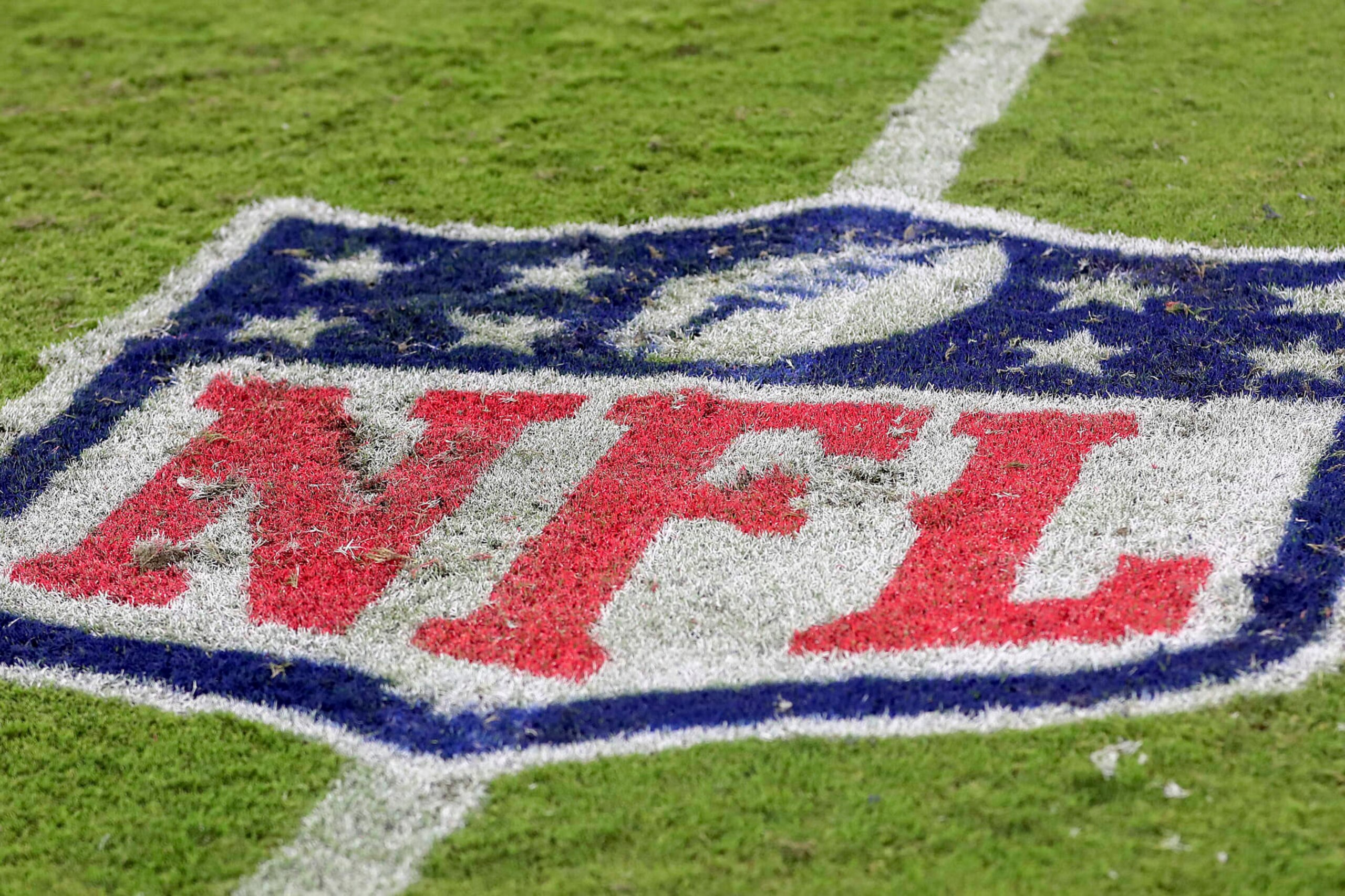The NFL logo is painted on the turf during a NFL football game at EverBank Stadium, Saturday, August 26, 2023 in Jacksonville, Fla. (AP Photo/Alex Menendez)