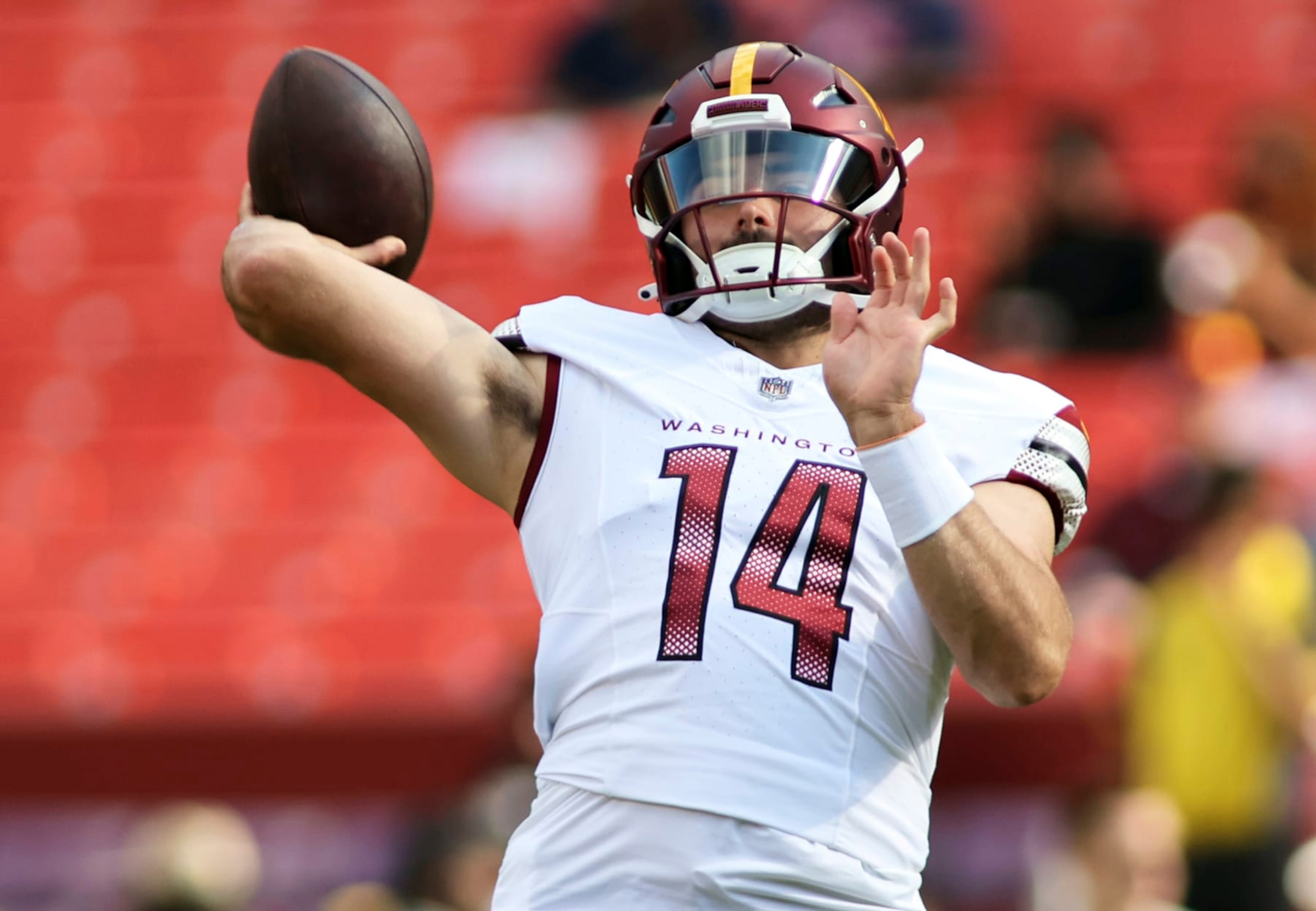 Washington Commanders quarterback Sam Howell (14) throws before an NFL preseason football game against the Cincinnati Bengals, Saturday, August 26, 2023 in Landover. (AP Photo/Daniel Kucin Jr.)