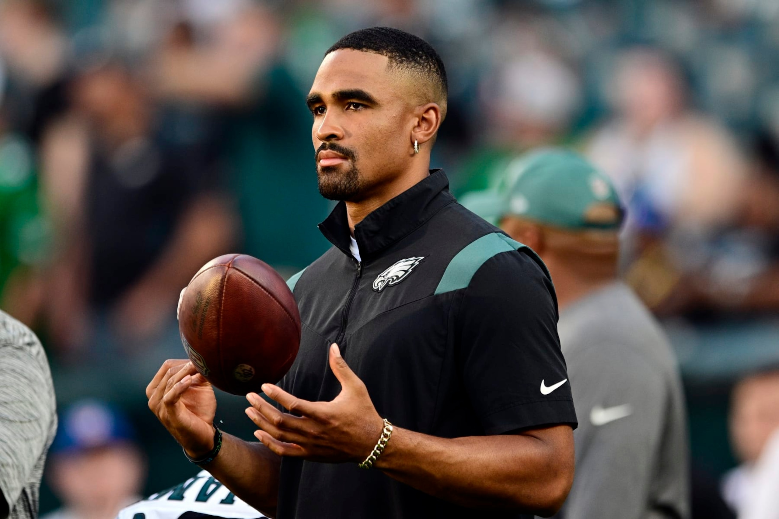 Philadelphia Eagles quarterback Jalen Hurts watches warm ups before an NFL preseason football game against the Cleveland Browns on Thursday, Aug. 17, 2023, in Philadelphia. (AP Photo/Derik Hamilton)