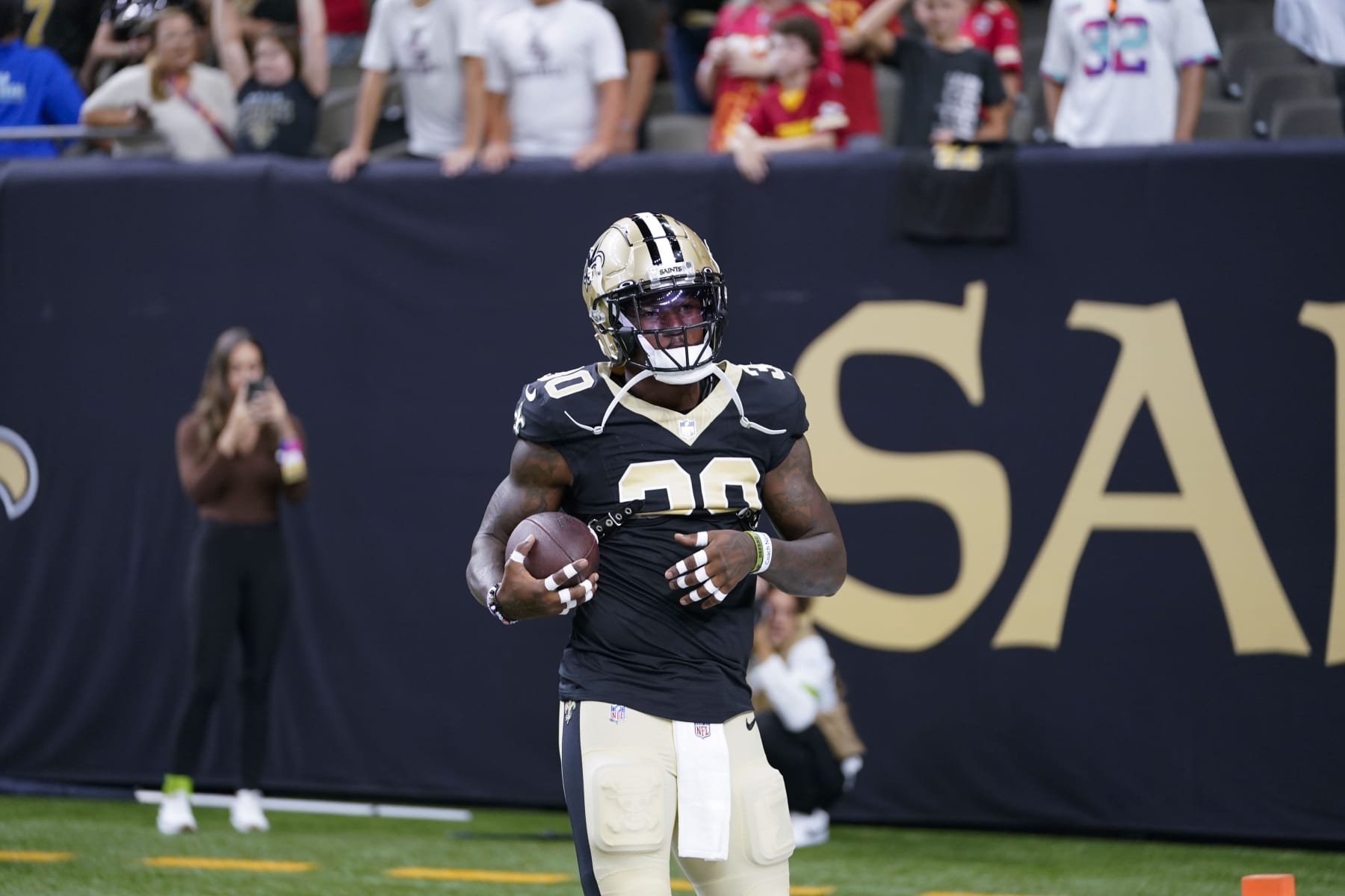 New Orleans Saints running back Jamaal Williams (30) warms up before an NFL football game against the Kansas City Chiefs in New Orleans, Sunday, Aug. 13, 2023. (AP Photo/Gerald Herbert)