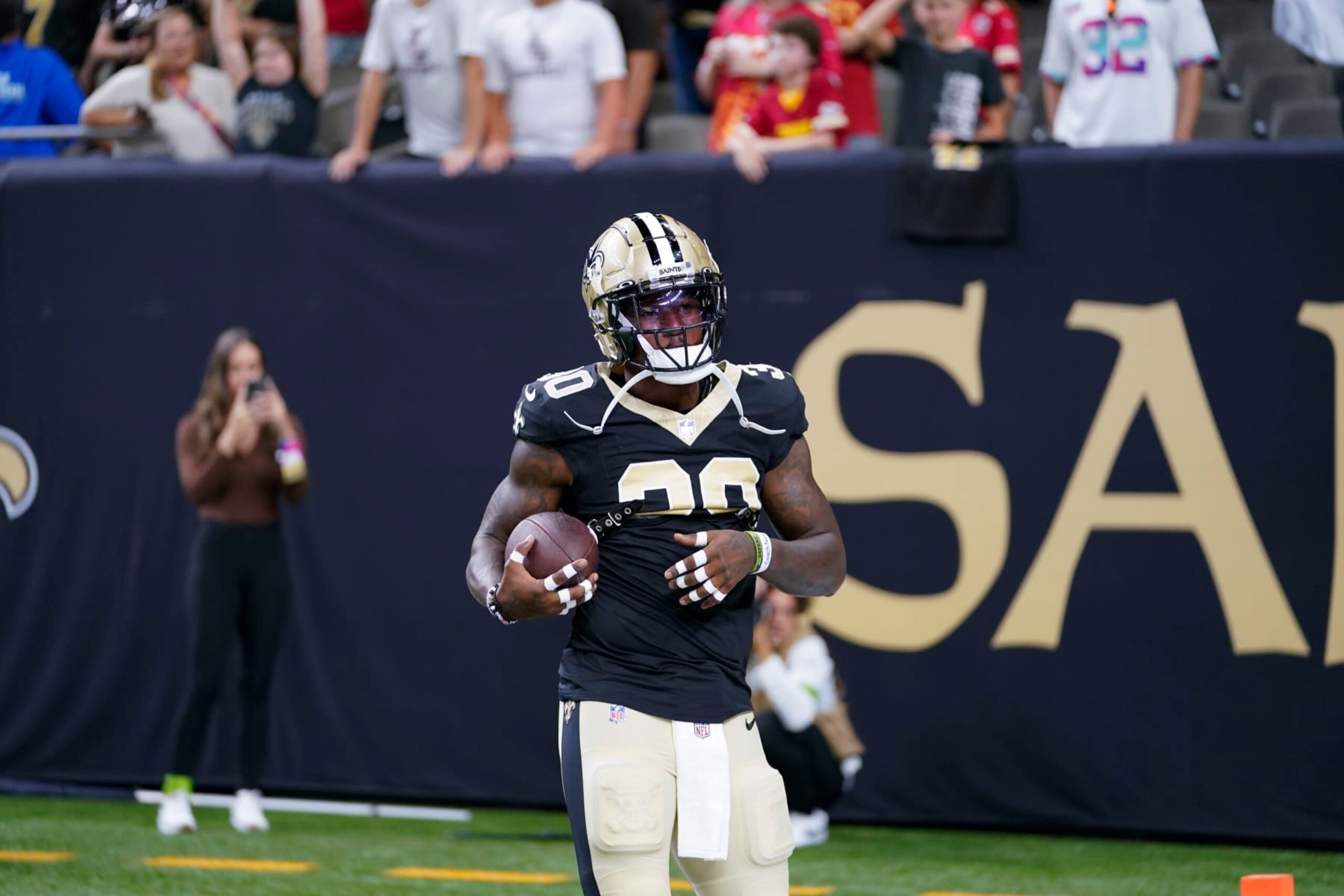 New Orleans Saints running back Jamaal Williams (30) warms up before an NFL football game against the Kansas City Chiefs in New Orleans, Sunday, Aug. 13, 2023. (AP Photo/Gerald Herbert)