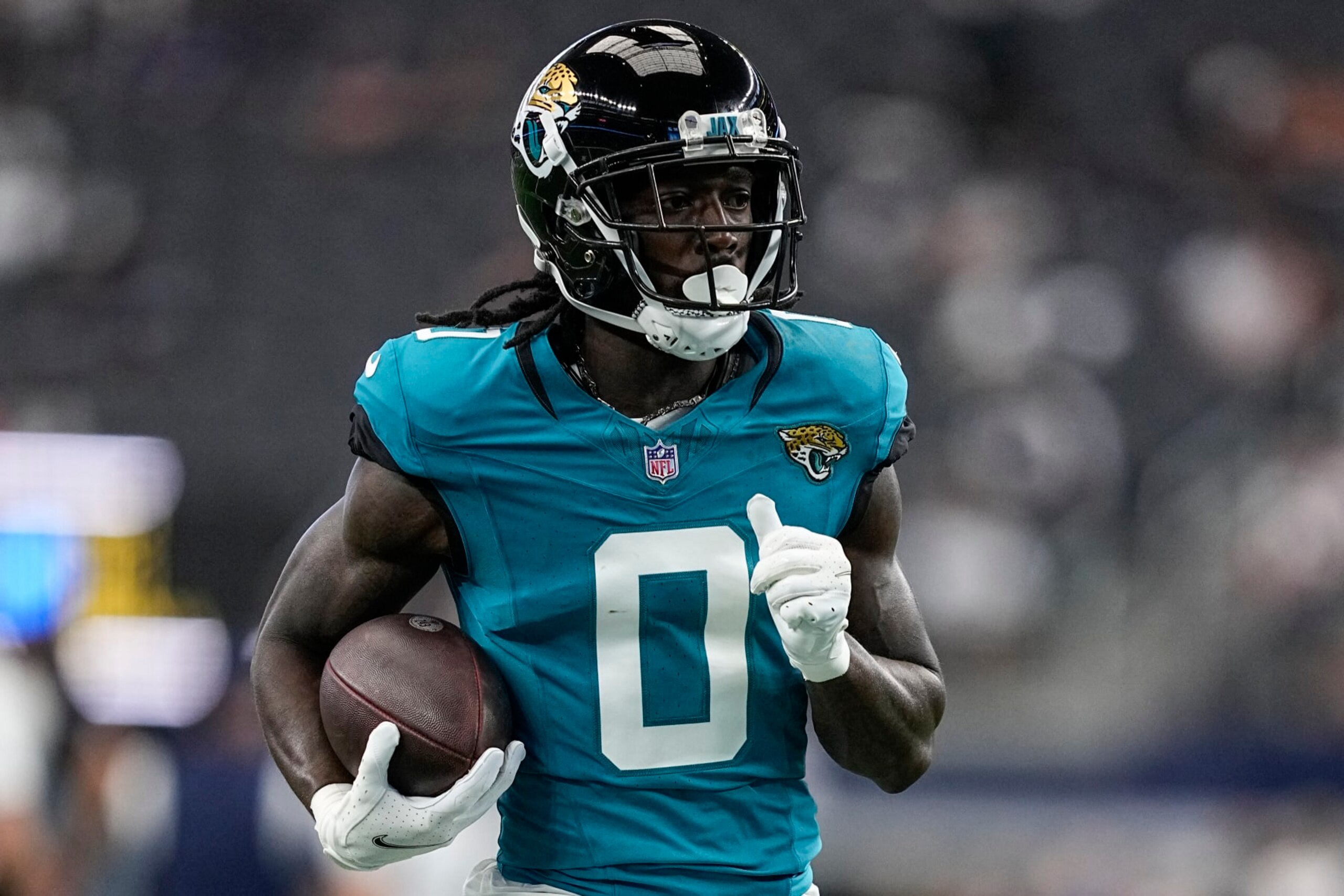 Jacksonville Jaguars wide receiver Calvin Ridley (0) runs drills before an NFL preseason football game against the Dallas Cowboys, Saturday, Aug. 12, 2023, in Arlington, Texas. (AP Photo/Tony Gutierrez)