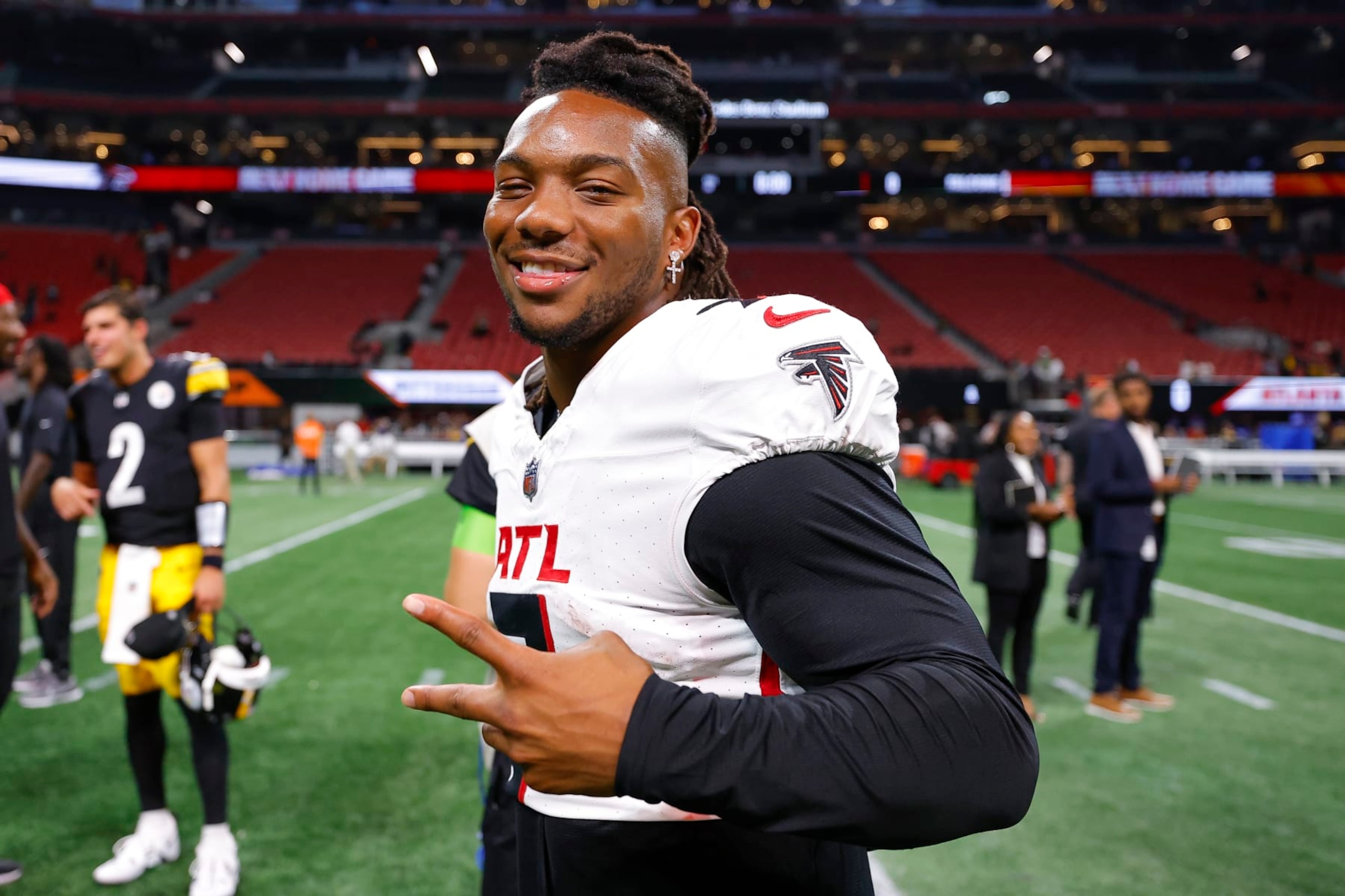 ATLANTA, GEORGIA - AUGUST 24: Bijan Robinson #7 of the Atlanta Falcons reacts at the conclusion of a preseason game against the Pittsburgh Steelers at Mercedes-Benz Stadium on August 24, 2023 in Atlanta, Georgia. (Photo by Todd Kirkland/Getty Images) ATLANTA, GEORGIA - AUGUST 24: Bijan Robinson #7 of the Atlanta Falcons reacts at the conclusion of a preseason game against the Pittsburgh Steelers at Mercedes-Benz Stadium on August 24, 2023 in Atlanta, Georgia. (Photo by Todd Kirkland/Getty Images)