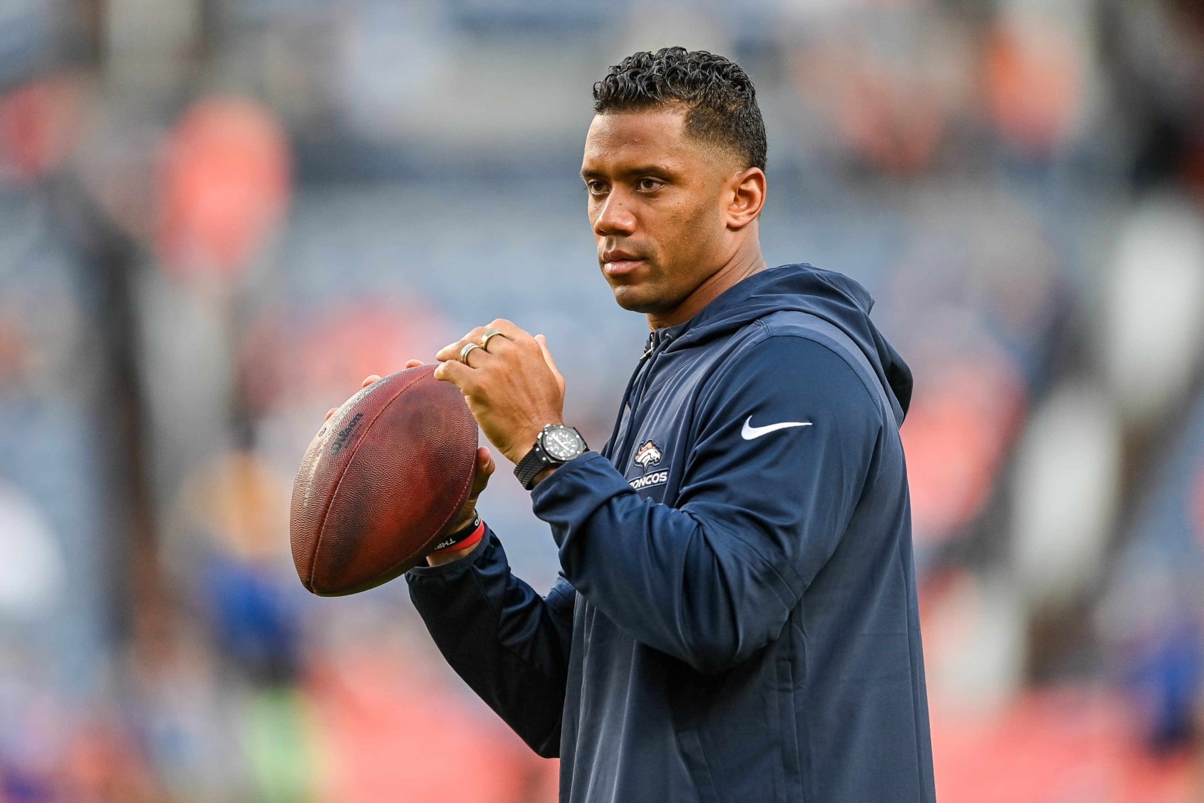 DENVER, COLORADO - AUGUST 26: Quarterback Russell Wilson of the Denver Broncos throws as players warm up before a game against the Los Angeles Rams at Empower Field at Mile High on August 26, 2023 in Denver, Colorado. (Photo by Dustin Bradford/Getty Images) DENVER, COLORADO - AUGUST 26: Quarterback Russell Wilson of the Denver Broncos throws as players warm up before a game against the Los Angeles Rams at Empower Field at Mile High on August 26, 2023 in Denver, Colorado. (Photo by Dustin Bradford/Getty Images)