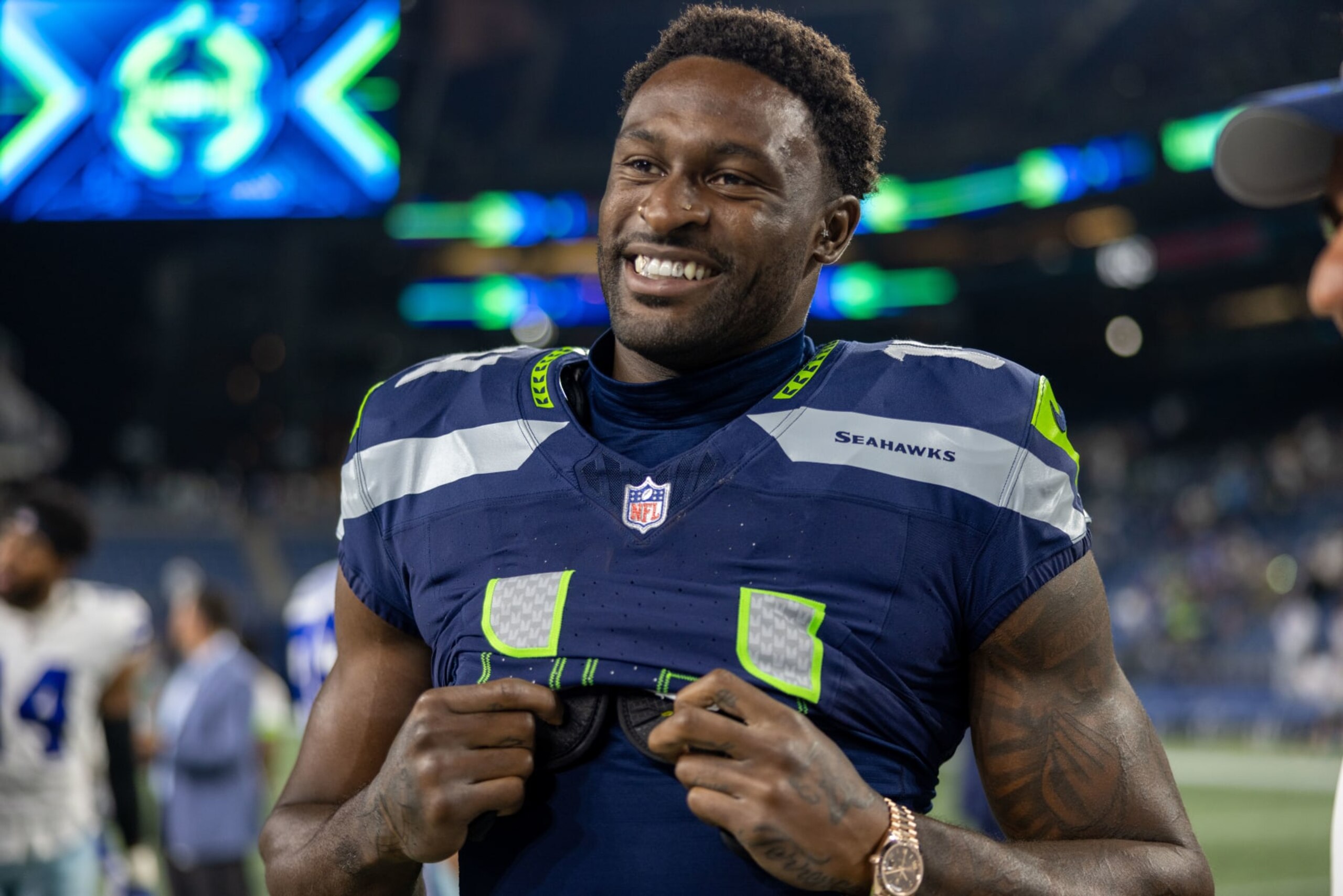 SEATTLE, WASHINGTON - AUGUST 19: DK Metcalf #14 of the Seattle Seahawks talks on the field after a preseason game against the Dallas Cowboys at Lumen Field on August 19, 2023 in Seattle, Washington. (Photo by Tom Hauck/Getty Images) SEATTLE, WASHINGTON - AUGUST 19: DK Metcalf #14 of the Seattle Seahawks talks on the field after a preseason game against the Dallas Cowboys at Lumen Field on August 19, 2023 in Seattle, Washington. (Photo by Tom Hauck/Getty Images)