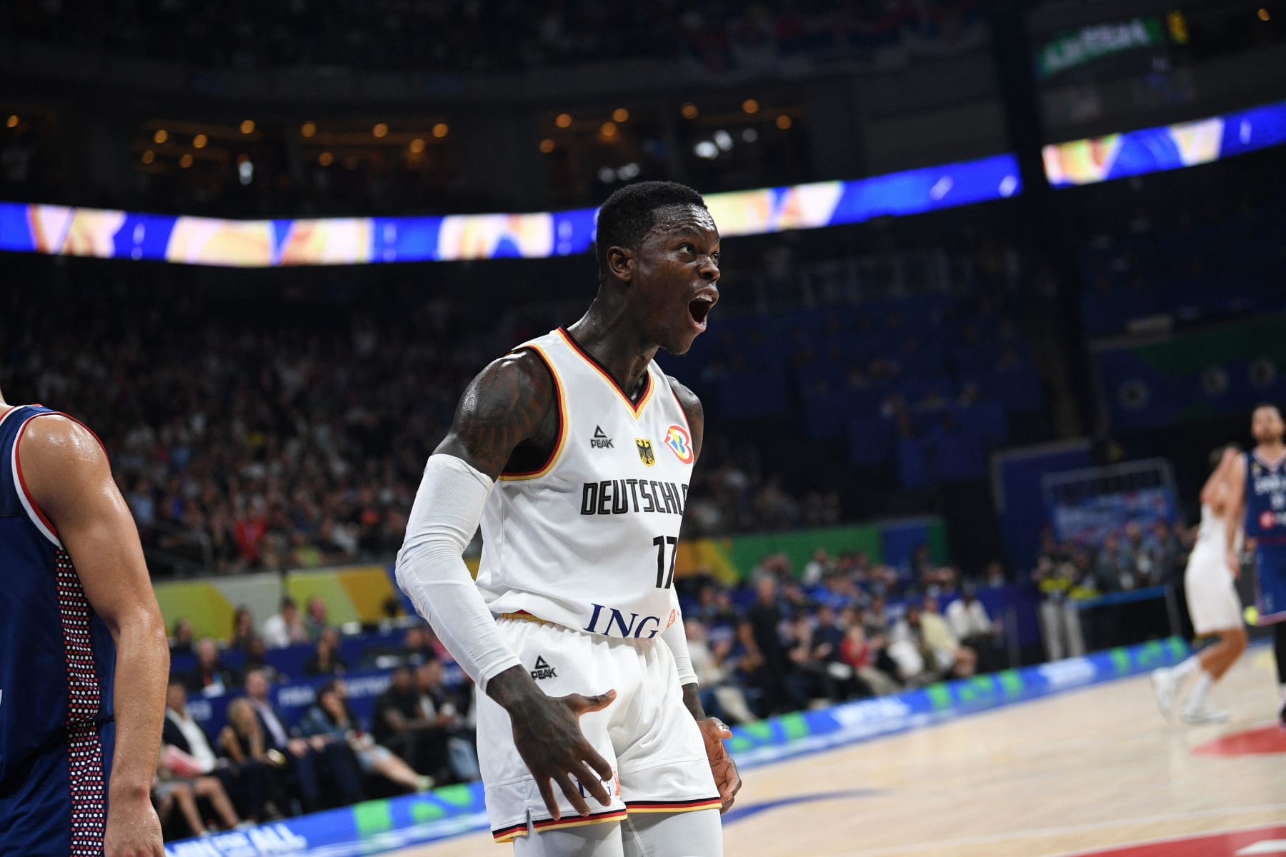 Germany's Dennis Schroder reacts after dunking the ball against Serbia during the FIBA Basketball World Cup final game between Germany and Serbia in Manila on September 10, 2023. (Photo by Ted ALJIBE / AFP) (Photo by TED ALJIBE/AFP via Getty Images)