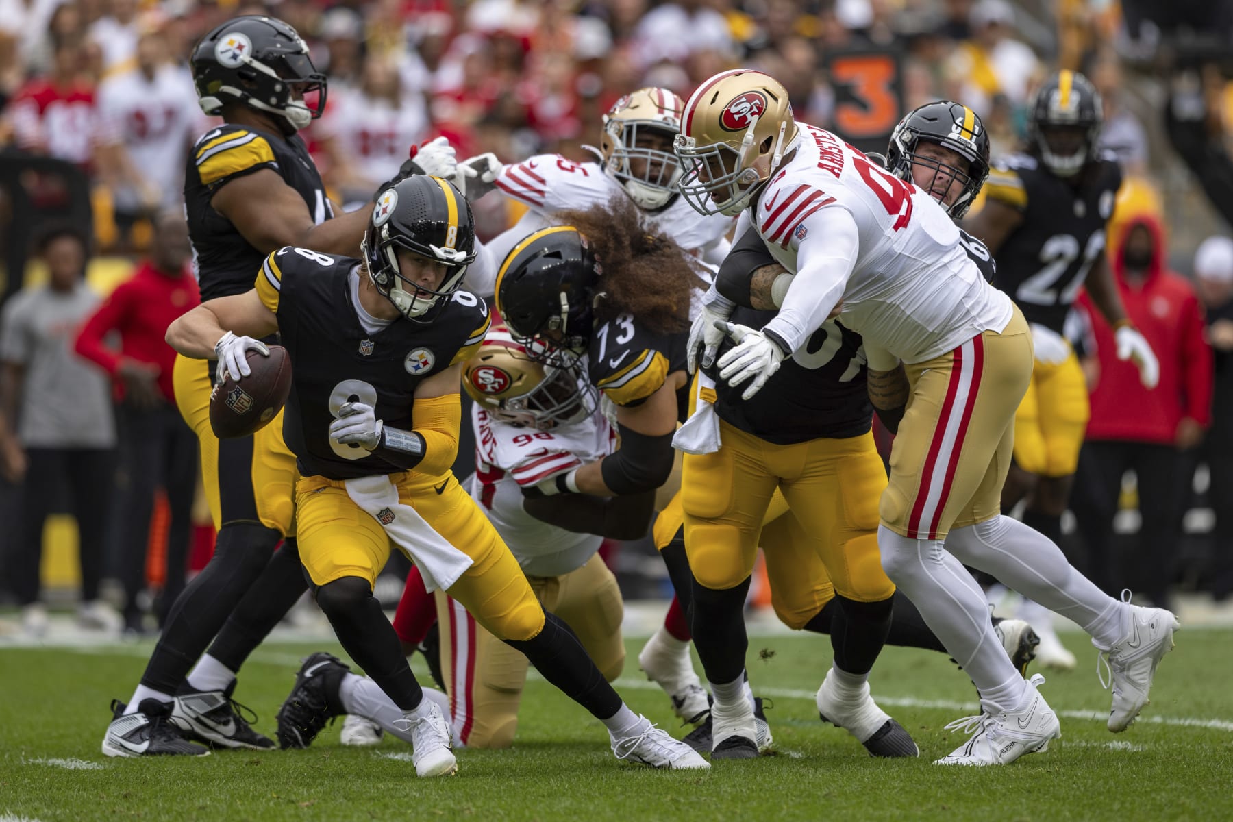 Pittsburgh Steelers quarterback Kenny Pickett (8) evades pressure from San Francisco 49ers defensive end Arik Armstead (91) during an NFL football game, Sunday, Sept. 10, 2023, in Pittsburgh. (AP Photo/Matt Durisko)