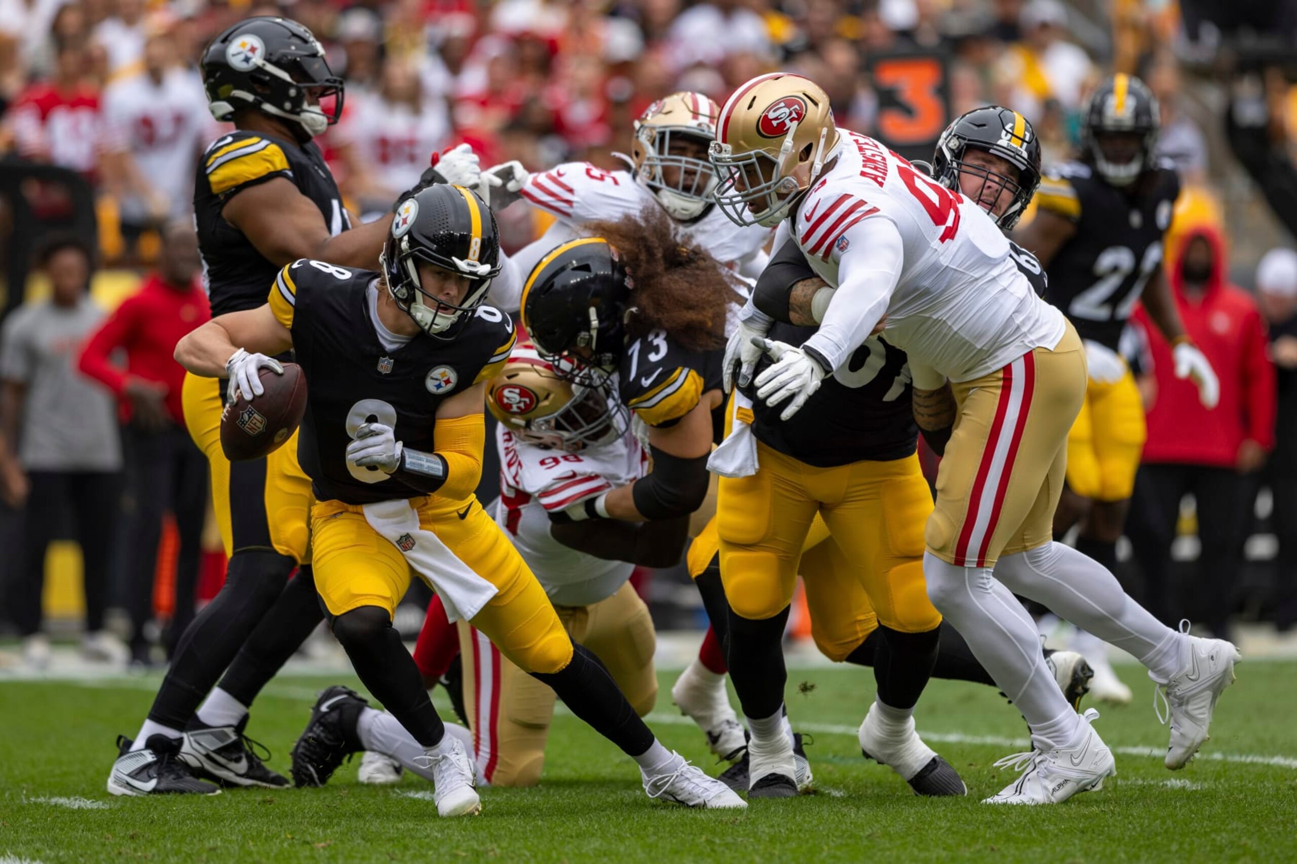 Pittsburgh Steelers quarterback Kenny Pickett (8) evades pressure from San Francisco 49ers defensive end Arik Armstead (91) during an NFL football game, Sunday, Sept. 10, 2023, in Pittsburgh. (AP Photo/Matt Durisko)