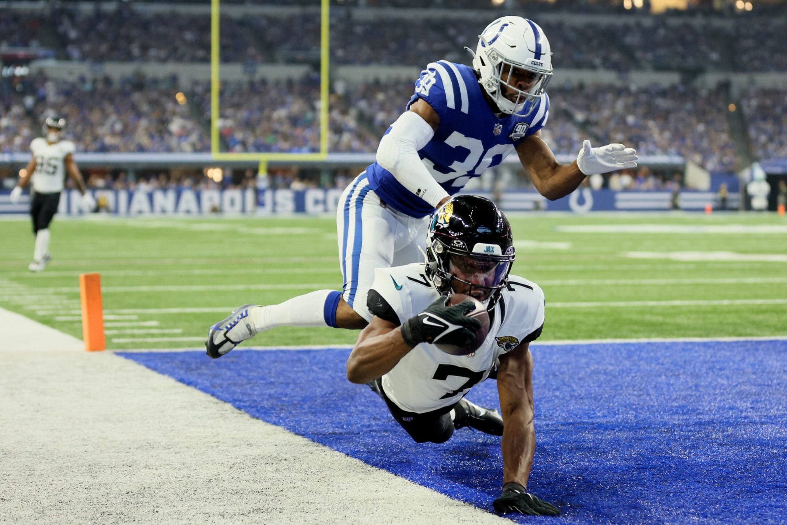 INDIANAPOLIS, INDIANA - SEPTEMBER 10: Zay Jones #7 of the Jacksonville Jaguars catches a touchdown against Darrell Baker Jr. #39 of the Indianapolis Colts in the first half of a game at Lucas Oil Stadium on September 10, 2023 in Indianapolis, Indiana. (Photo by Andy Lyons/Getty Images)