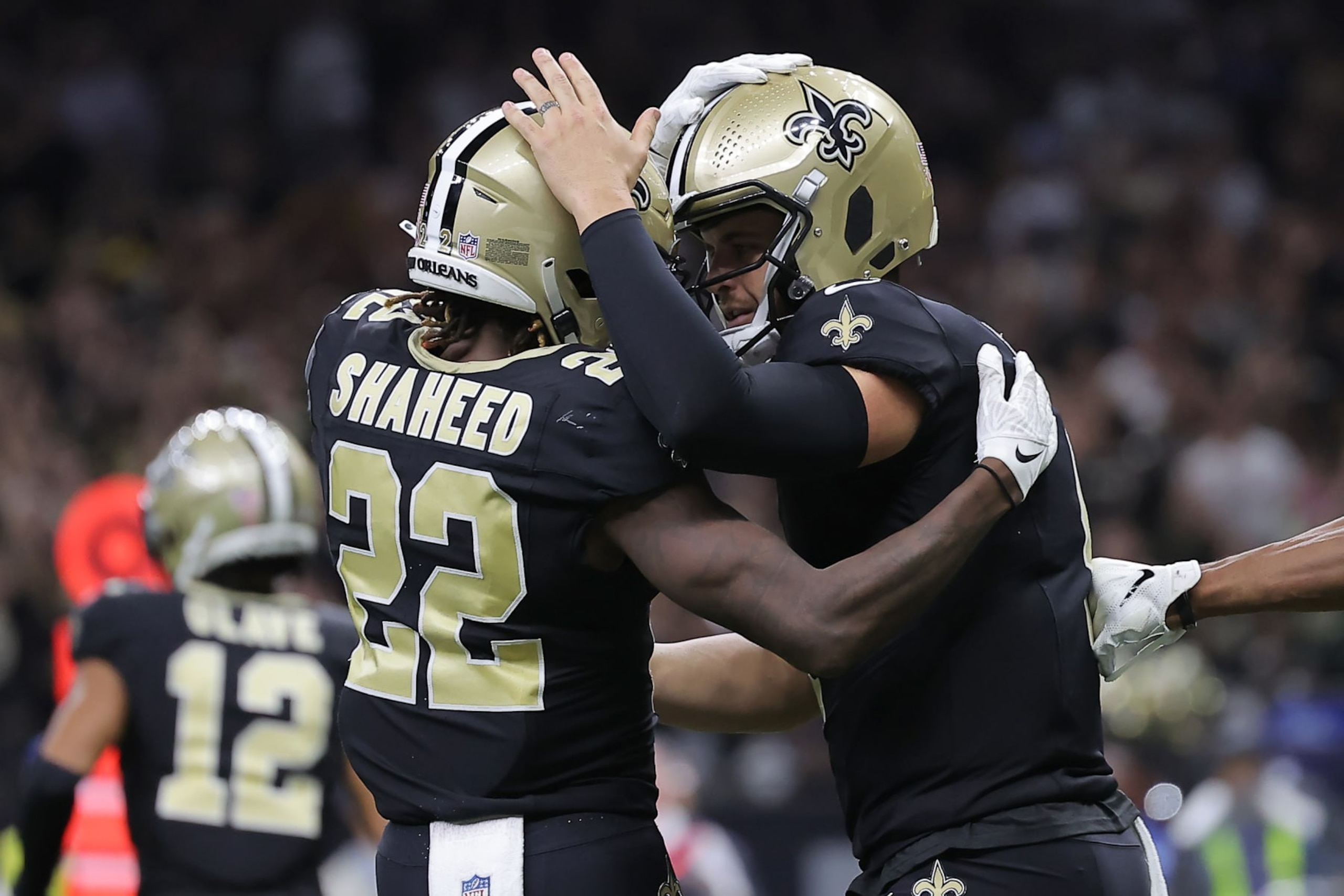 NEW ORLEANS, LOUISIANA - SEPTEMBER 10: Rashid Shaheed #22 of the New Orleans Saints celebrates with Derek Carr #4 of the New Orleans Saints after Shaheed's touchdown reception during the third quarter against the Tennessee Titans at Caesars Superdome on September 10, 2023 in New Orleans, Louisiana. (Photo by Jonathan Bachman/Getty Images)
