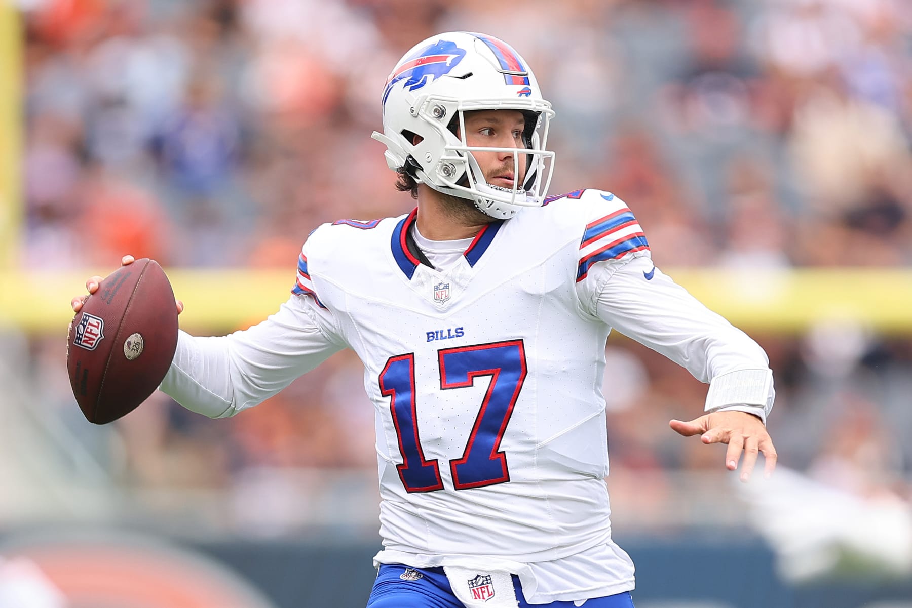 CHICAGO, ILLINOIS - AUGUST 26: Josh Allen #17 of the Buffalo Bills throws a pass against the Chicago Bears during the first half of a preseason game at Soldier Field on August 26, 2023 in Chicago, Illinois. (Photo by Michael Reaves/Getty Images)