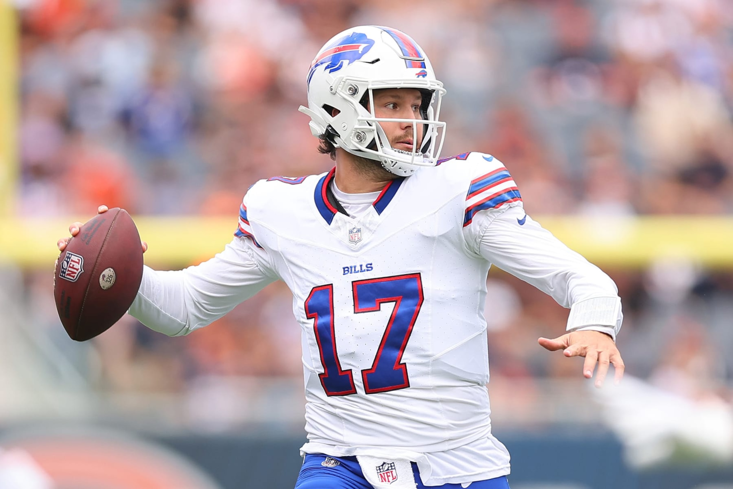 CHICAGO, ILLINOIS - AUGUST 26: Josh Allen #17 of the Buffalo Bills throws a pass against the Chicago Bears during the first half of a preseason game at Soldier Field on August 26, 2023 in Chicago, Illinois. (Photo by Michael Reaves/Getty Images)