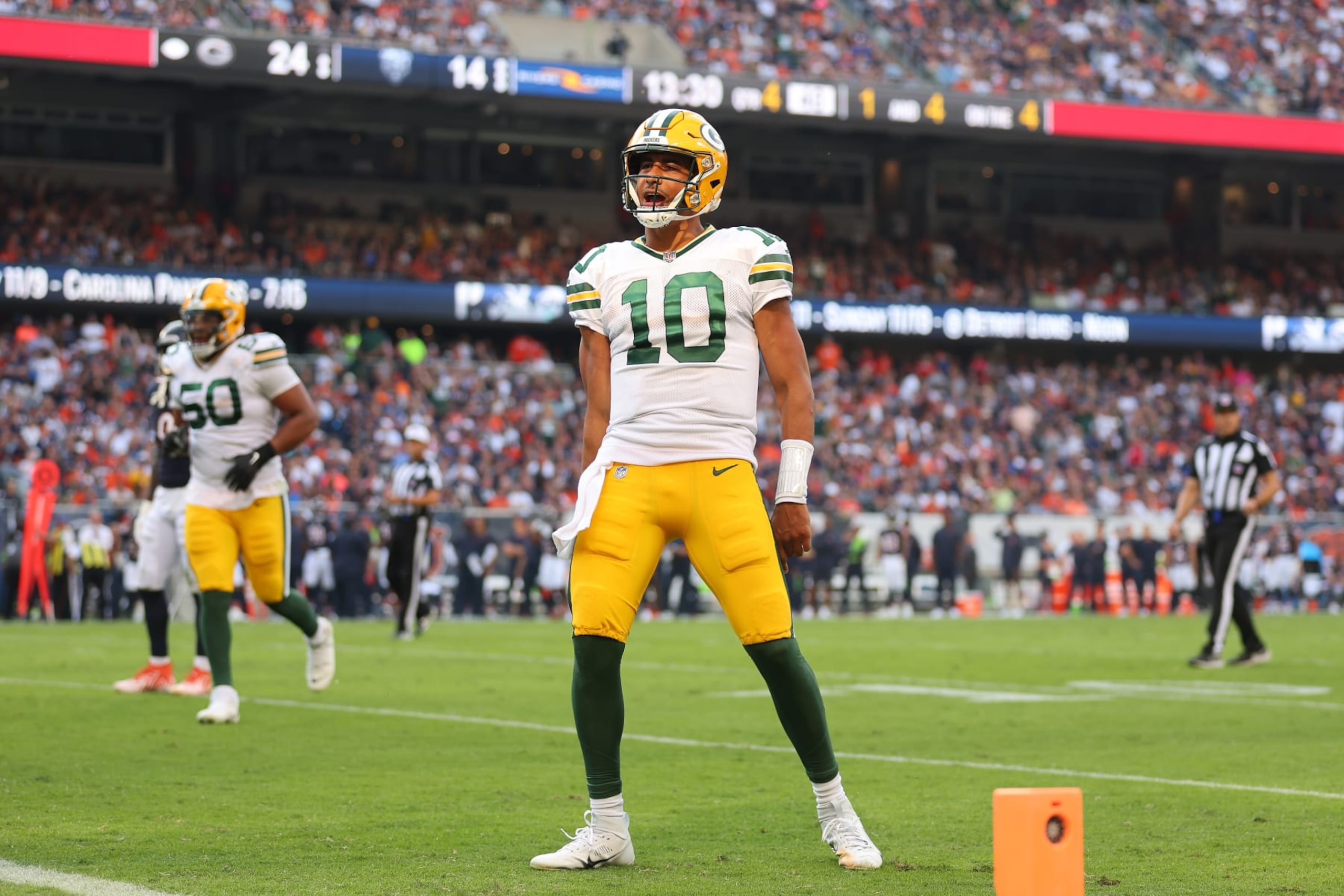CHICAGO, ILLINOIS - SEPTEMBER 10:  Jordan Love #10 of the Green Bay Packers celebrates a touchdown pass to Romeo Doubs (not pictured) against the Chicago Bears during the second half at Soldier Field on September 10, 2023 in Chicago, Illinois. (Photo by Michael Reaves/Getty Images)