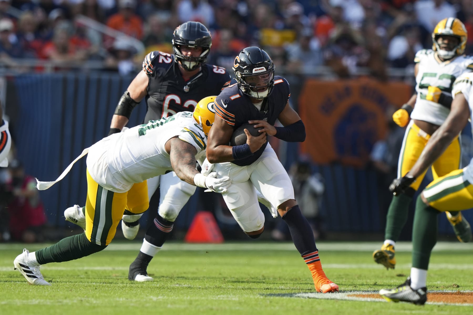 CHICAGO, IL - SEPTEMBER 10:  Quarterback Justin Fields #1 of the Chicago Bears runs the ball during an NFL football game against the Green Bay Packers at Soldier Field on September 10, 2023 in Chicago, Illinois. (Photo by Todd Rosenberg/Getty Images)