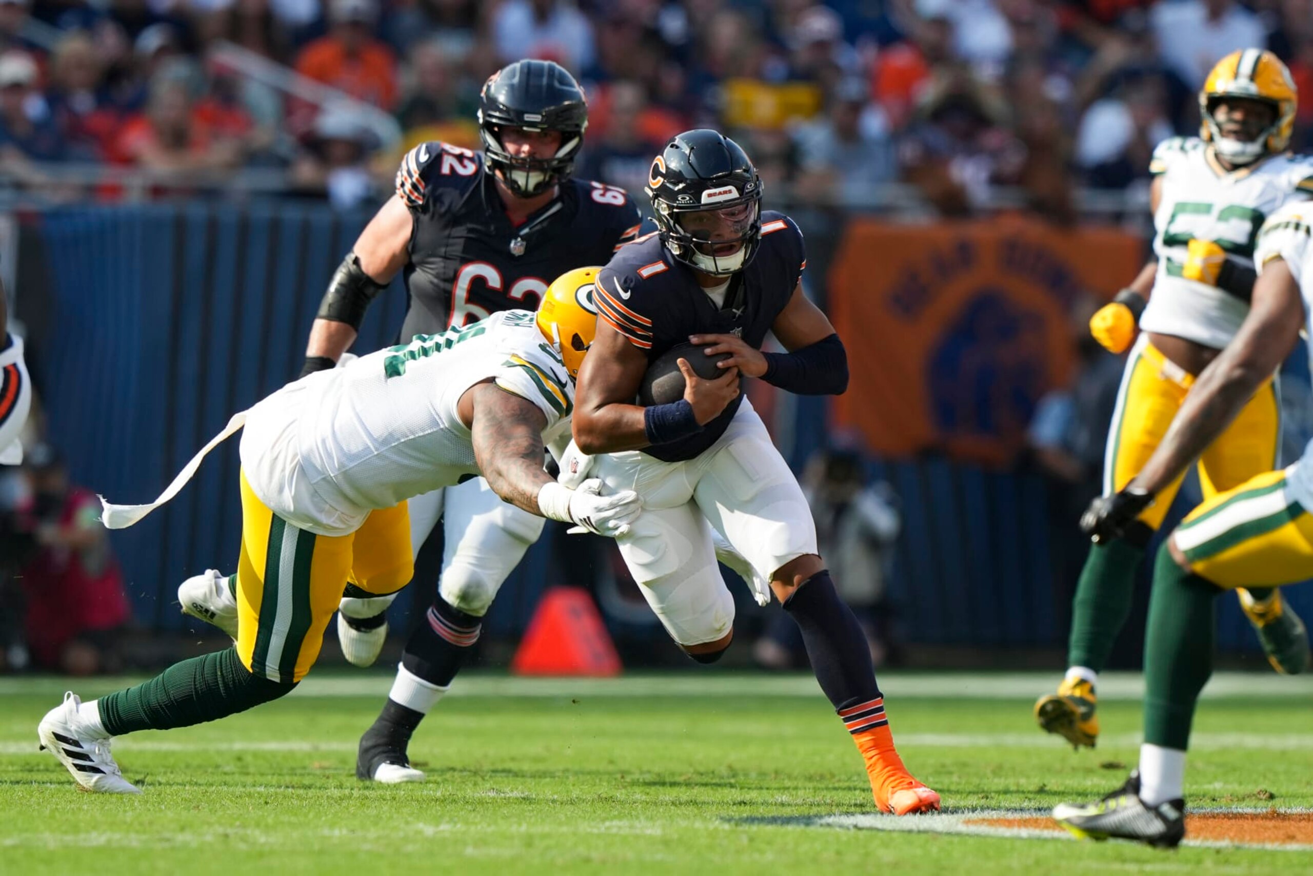 CHICAGO, IL - SEPTEMBER 10:  Quarterback Justin Fields #1 of the Chicago Bears runs the ball during an NFL football game against the Green Bay Packers at Soldier Field on September 10, 2023 in Chicago, Illinois. (Photo by Todd Rosenberg/Getty Images)