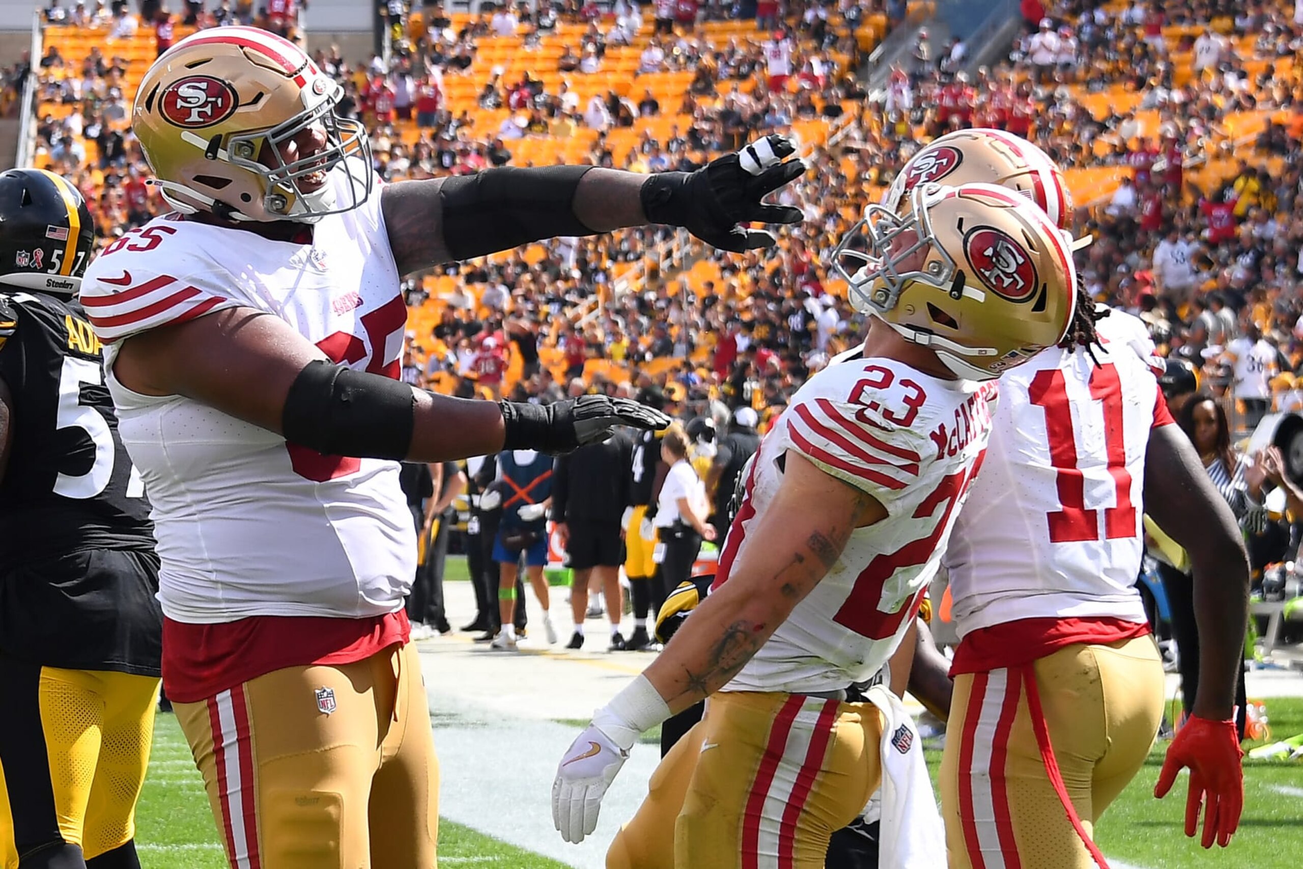 PITTSBURGH, PENNSYLVANIA - SEPTEMBER 10: Christian McCaffrey #23 of the San Francisco 49ers celebrates with Aaron Banks after a touchdown in the third quarter of a game against the Pittsburgh Steelers at Acrisure Stadium on September 10, 2023 in Pittsburgh, Pennsylvania. (Photo by Joe Sargent/Getty Images)